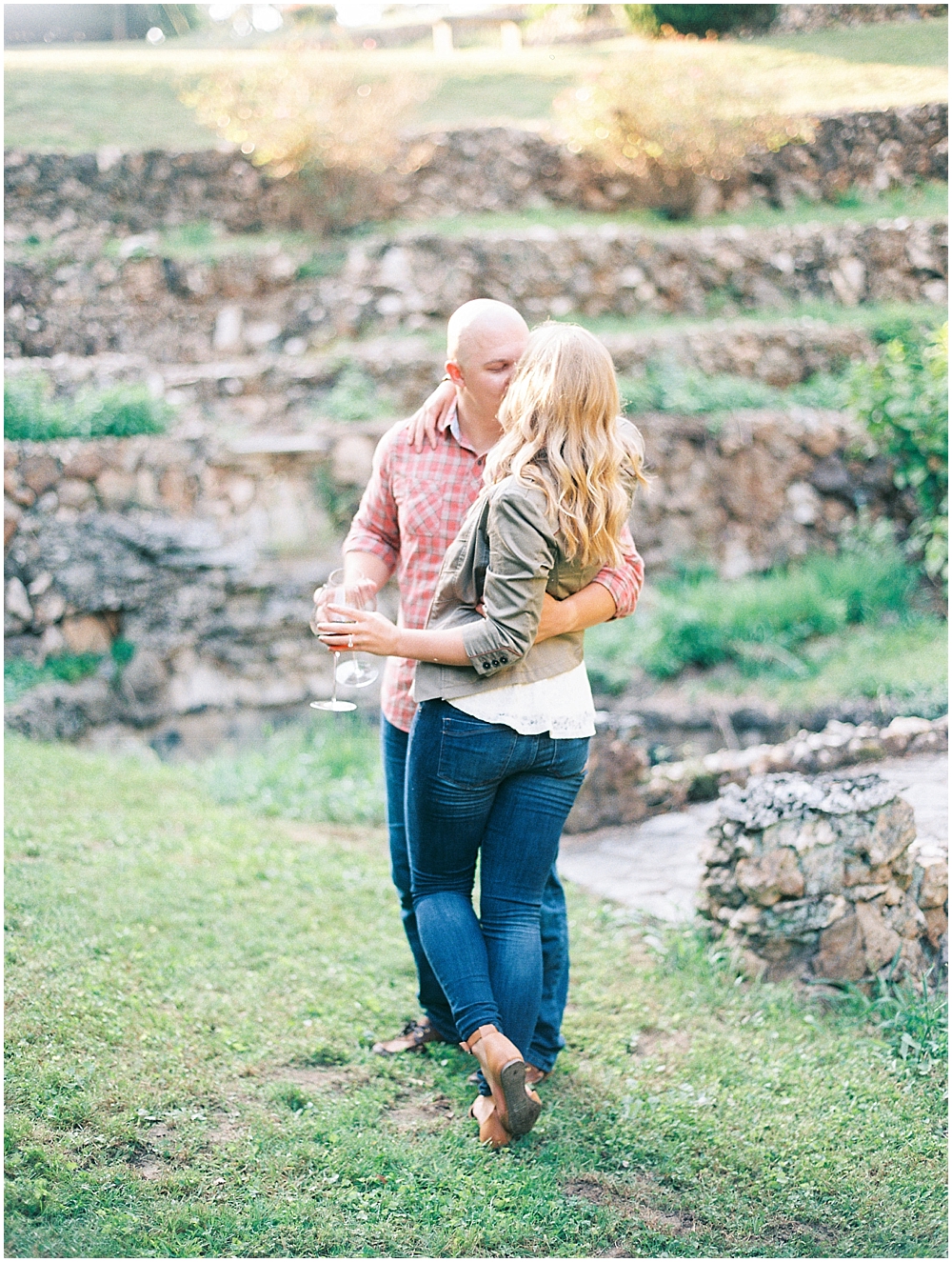 Happy couple kissing during their engagement session  