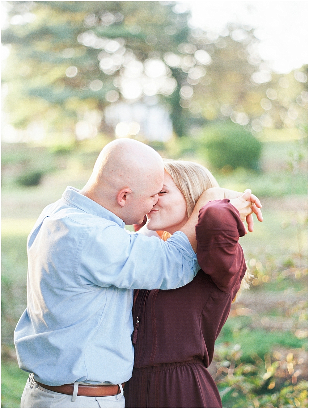 Happy and romantic couple kissing - St Louis MO Engagement