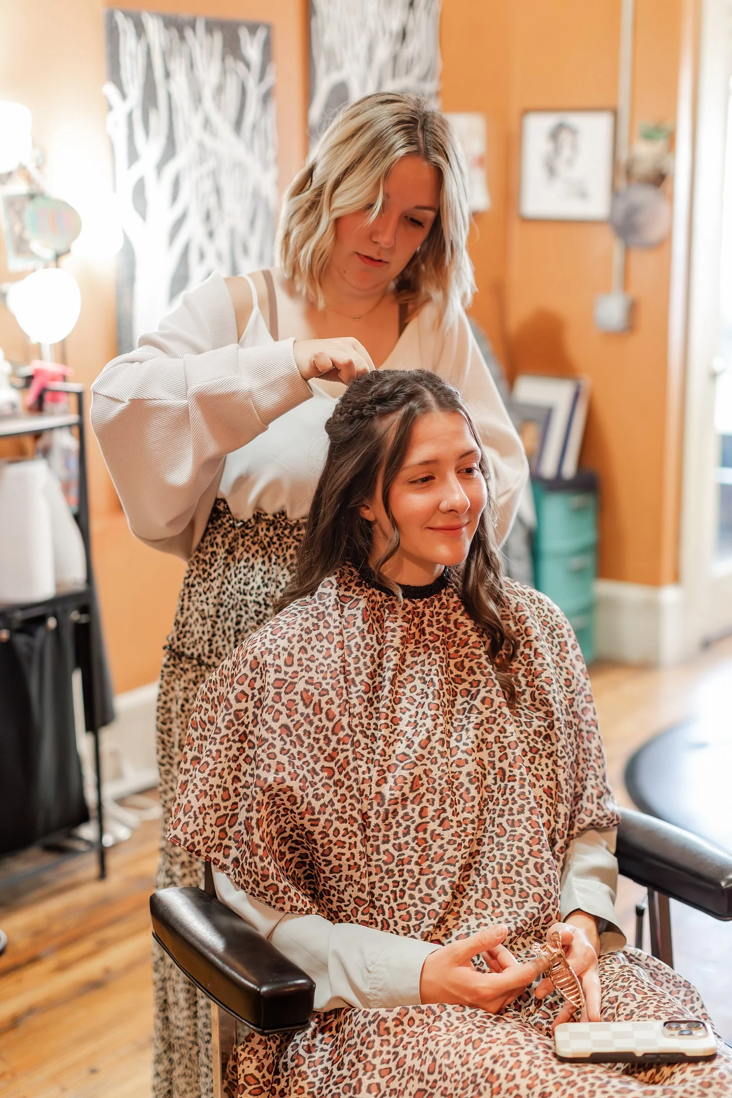 stylist standing behind a smiling client to check the curled style, Hair, Heart and Soul, brand photography session, Bolivar MO