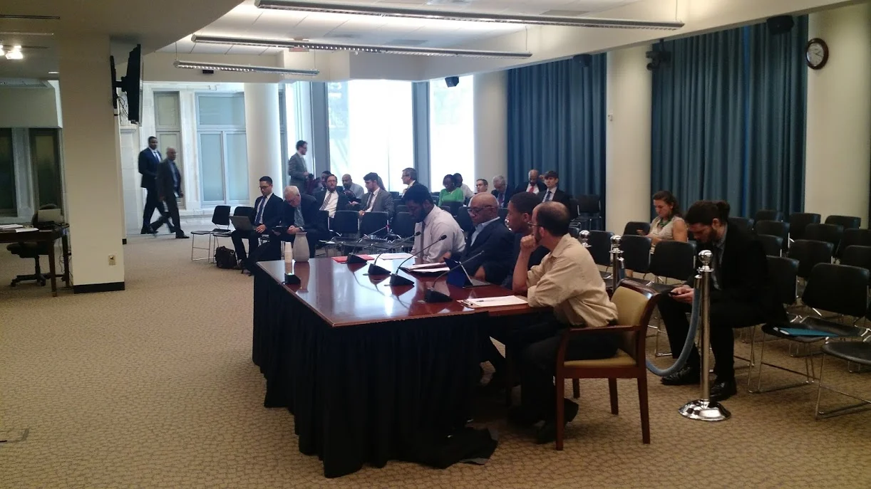 APACC members Malusi and Pastor Keith Kitchen testify to the Committee on Transportation and the Environment. 