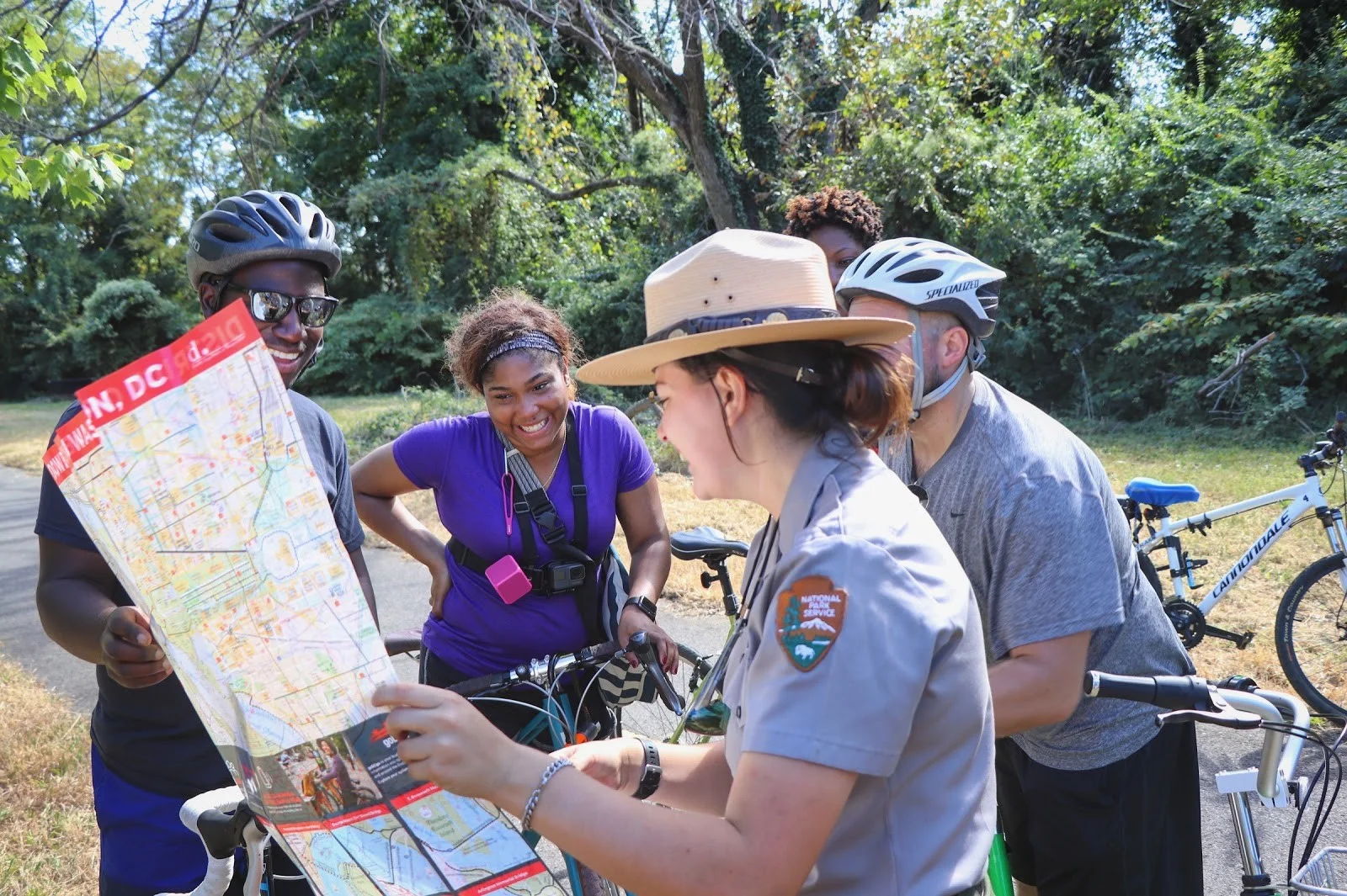 Park ranger provides directions to visitors on the Anacostia Riverwalk Trail. (NPS Photo)