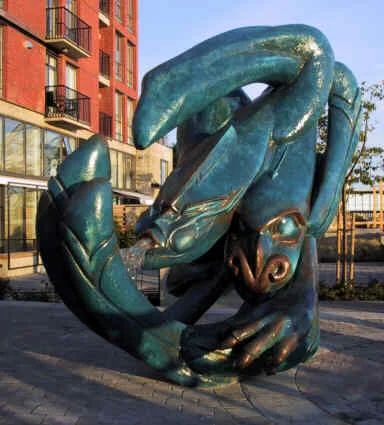 Photograph of finished sculpture in cast resin (with green patina). Winterstone was used as a model for the mold, allowing a hand crafted texture on the finished resin