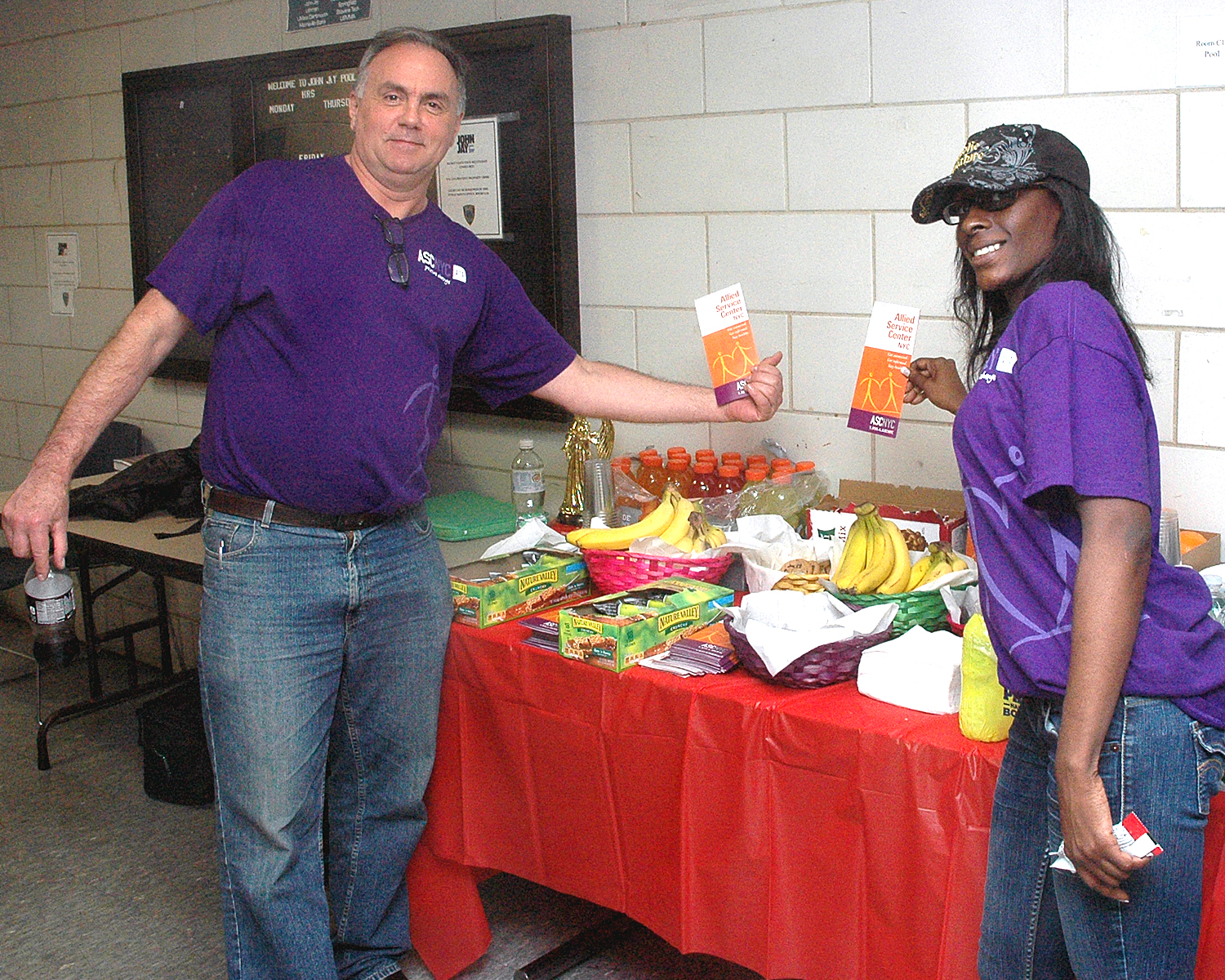 Conrad and Malika at the Outreach/Refreshment table