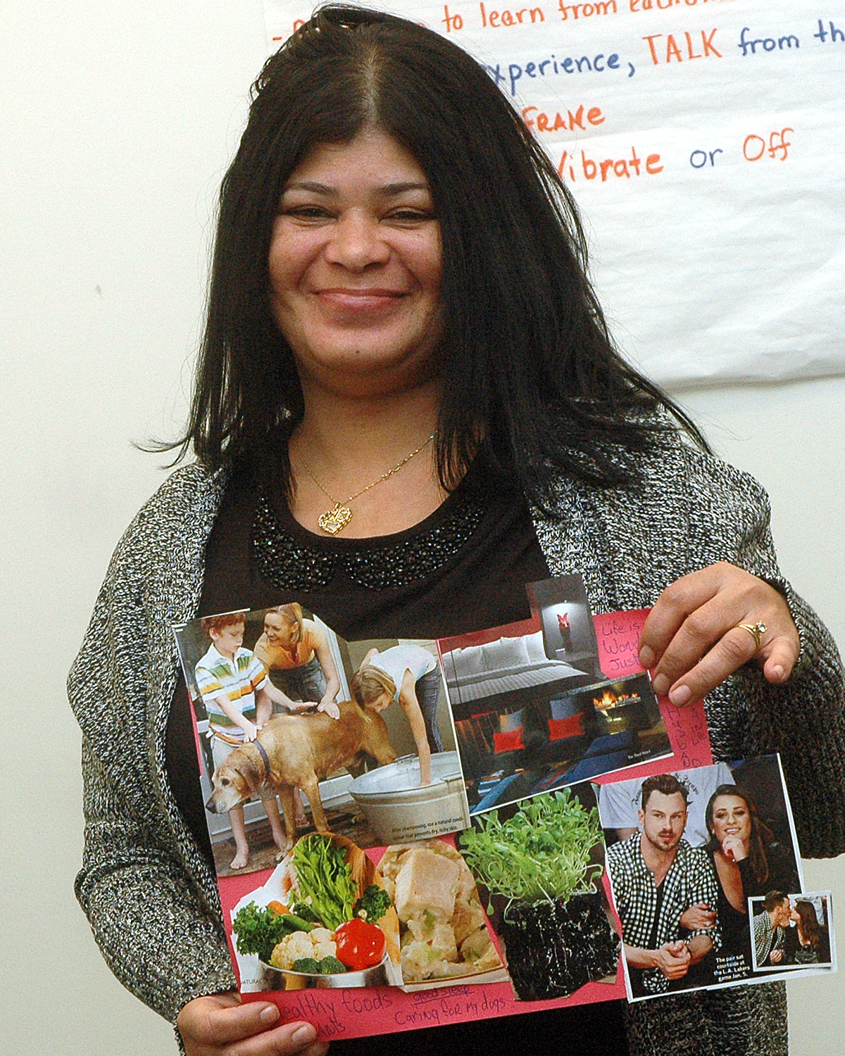 Sol C. showing off the collage that she made during the training