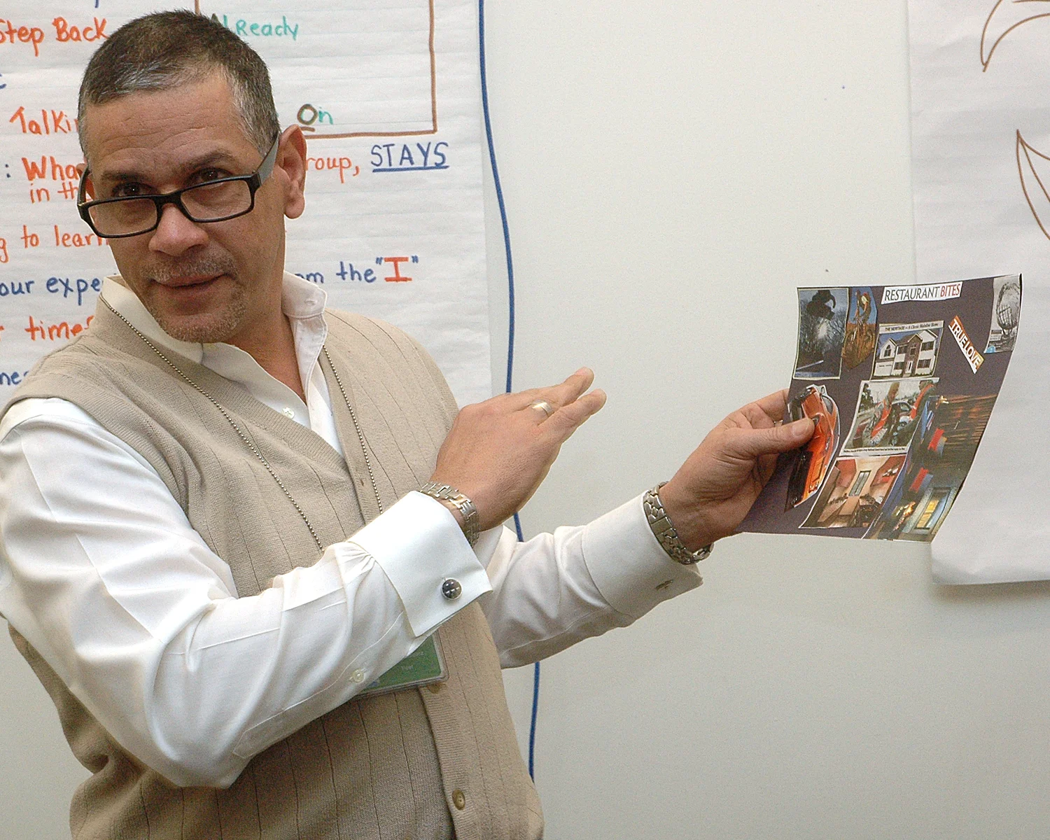 Angel V. showing off the collage that he made during the training