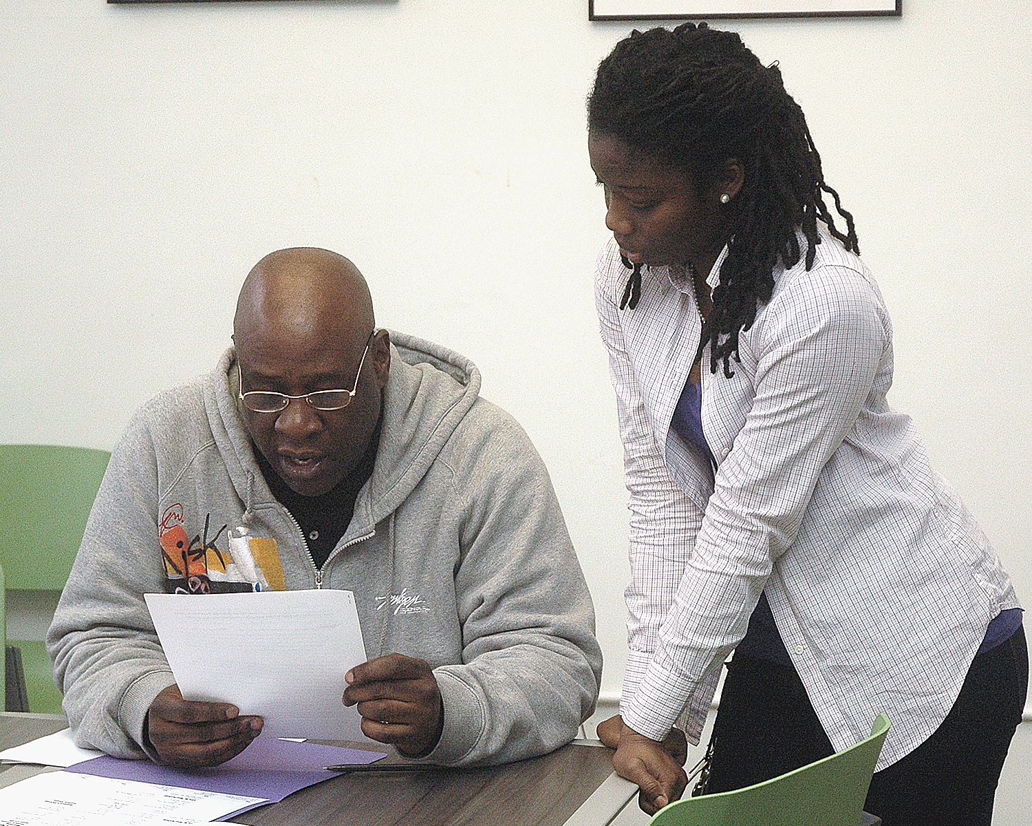 Shanaleigh helping a member of the Outreach Team