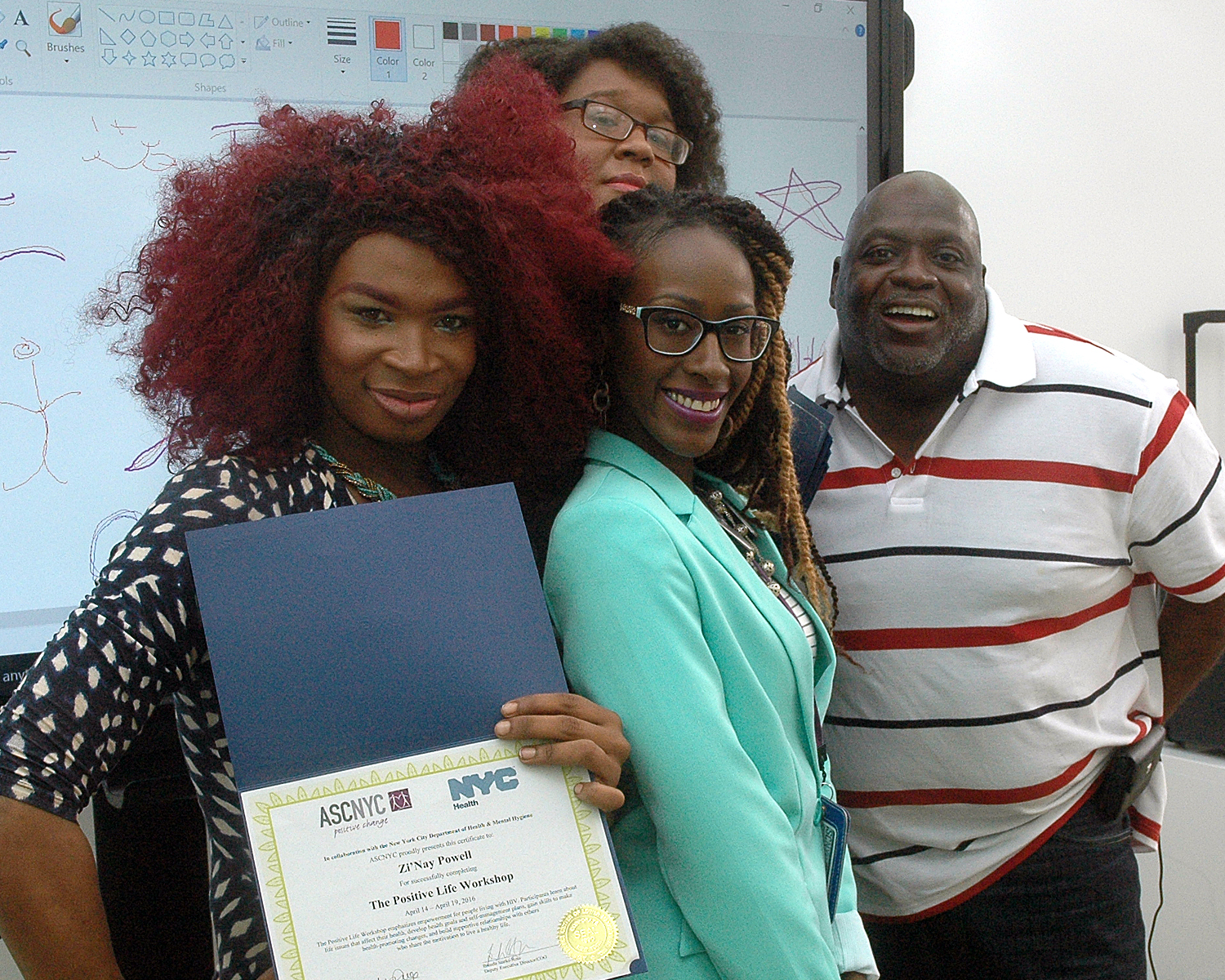 Zi'Nay P. with members of the training team