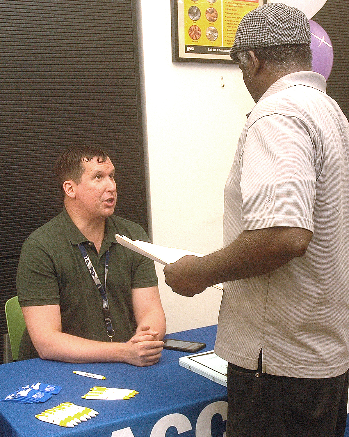 One of the job fair interviewers ... with an attendee