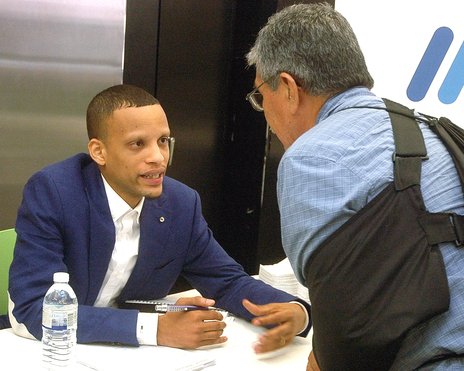 One of the job fair interviewers ... with an attendee