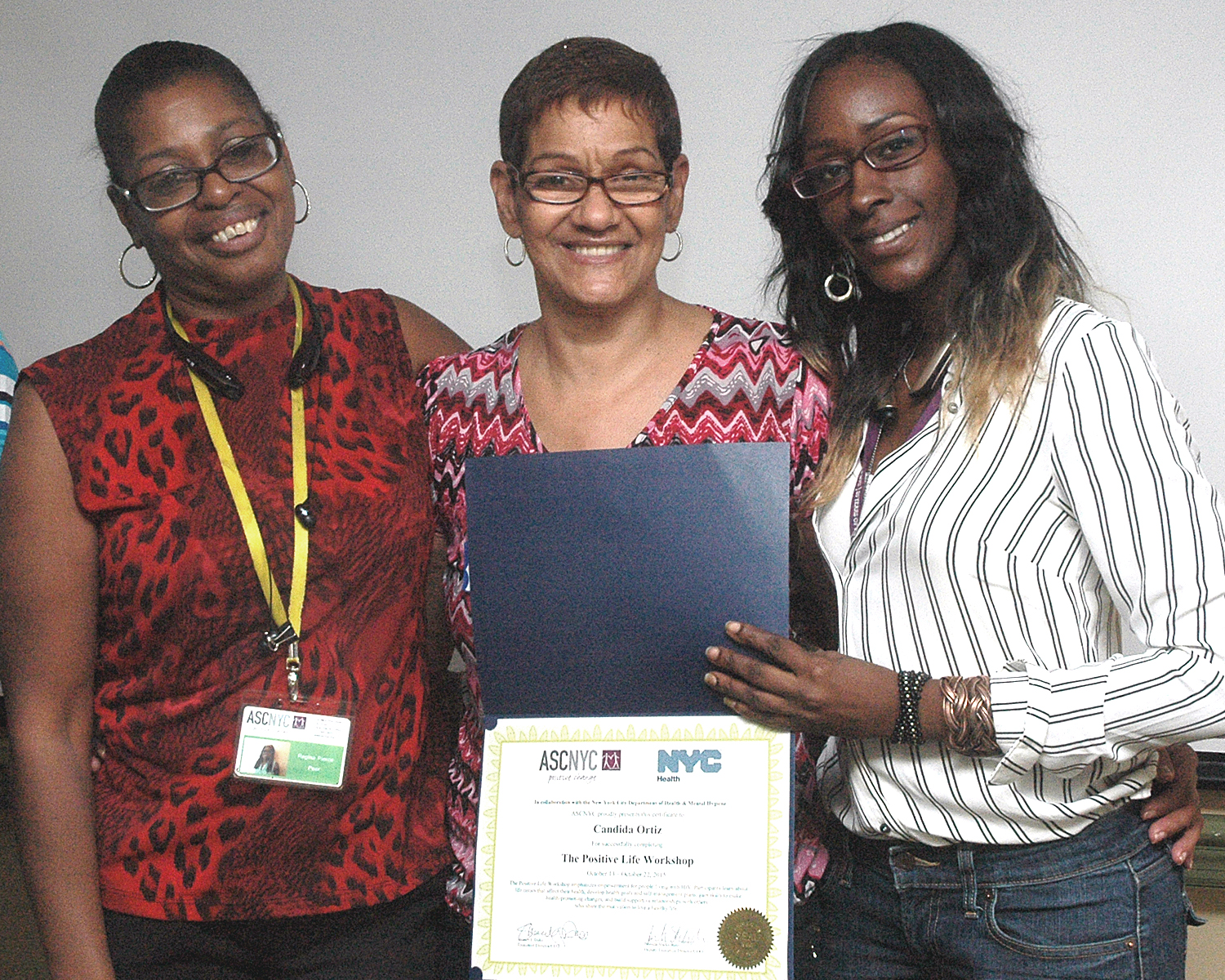 Candida O. receiving her certificate