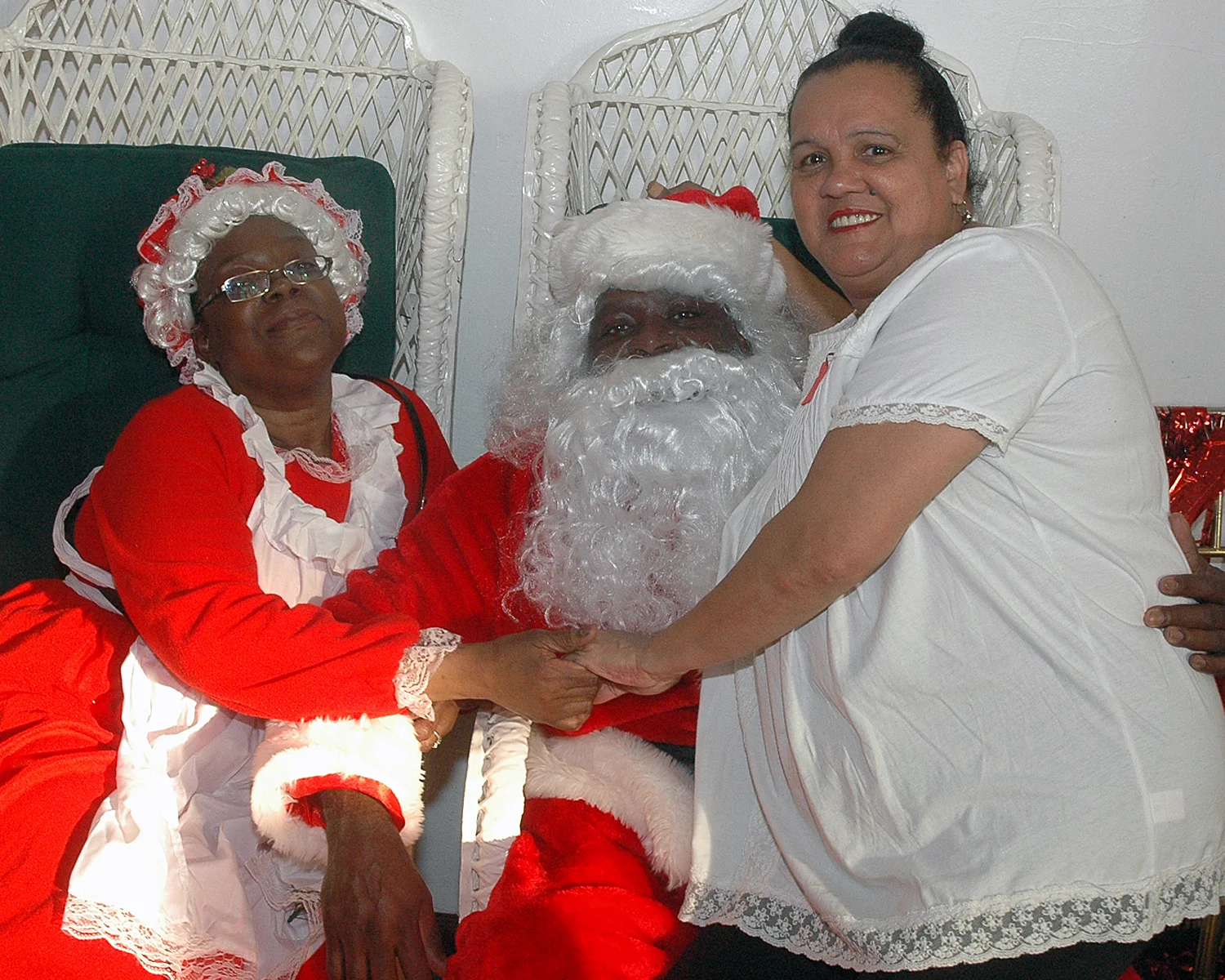 An attendee with two visitors from the North Pole