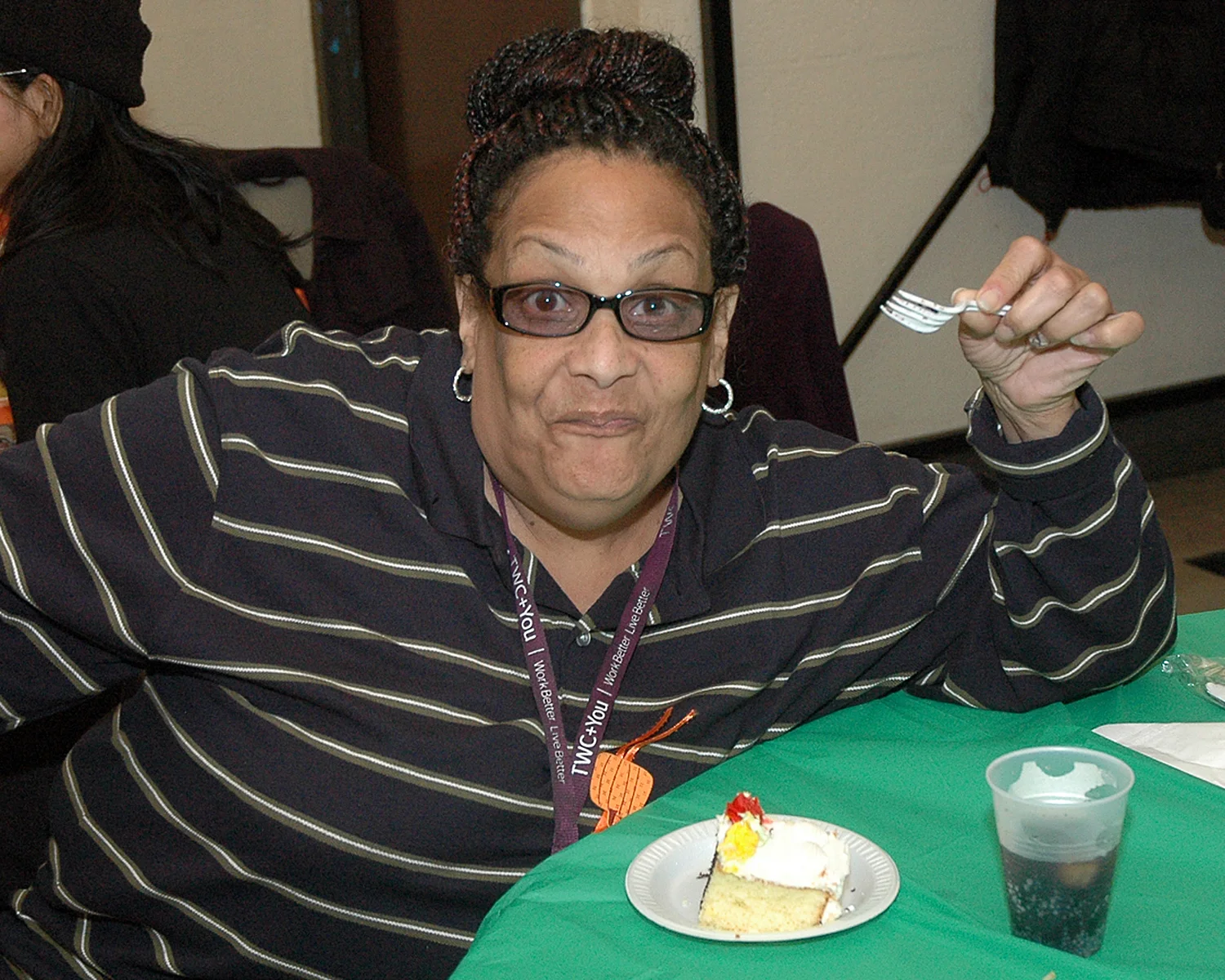 An attendee enjoying her dessert