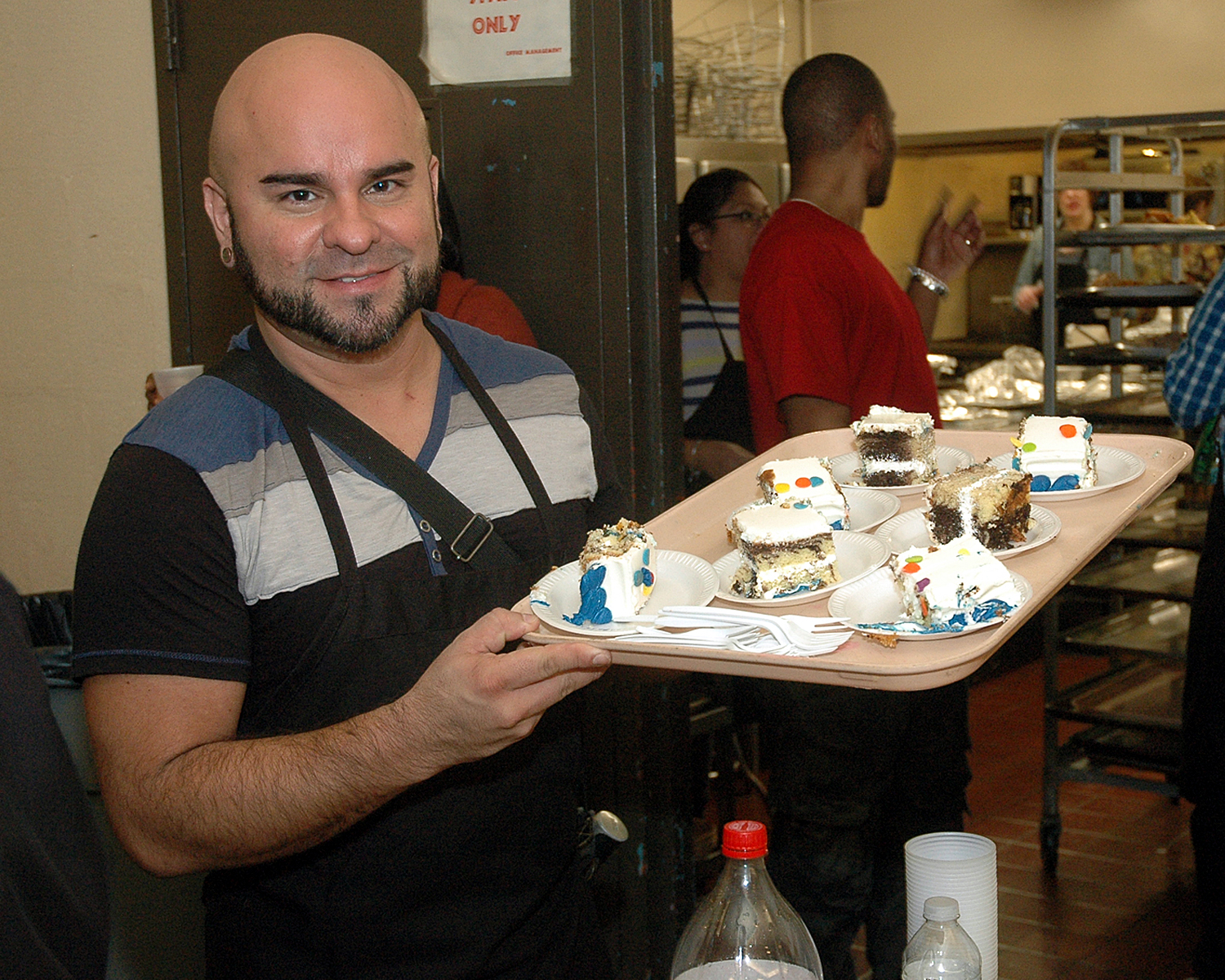 Rudolfo Chacin serving dessert to the attendees