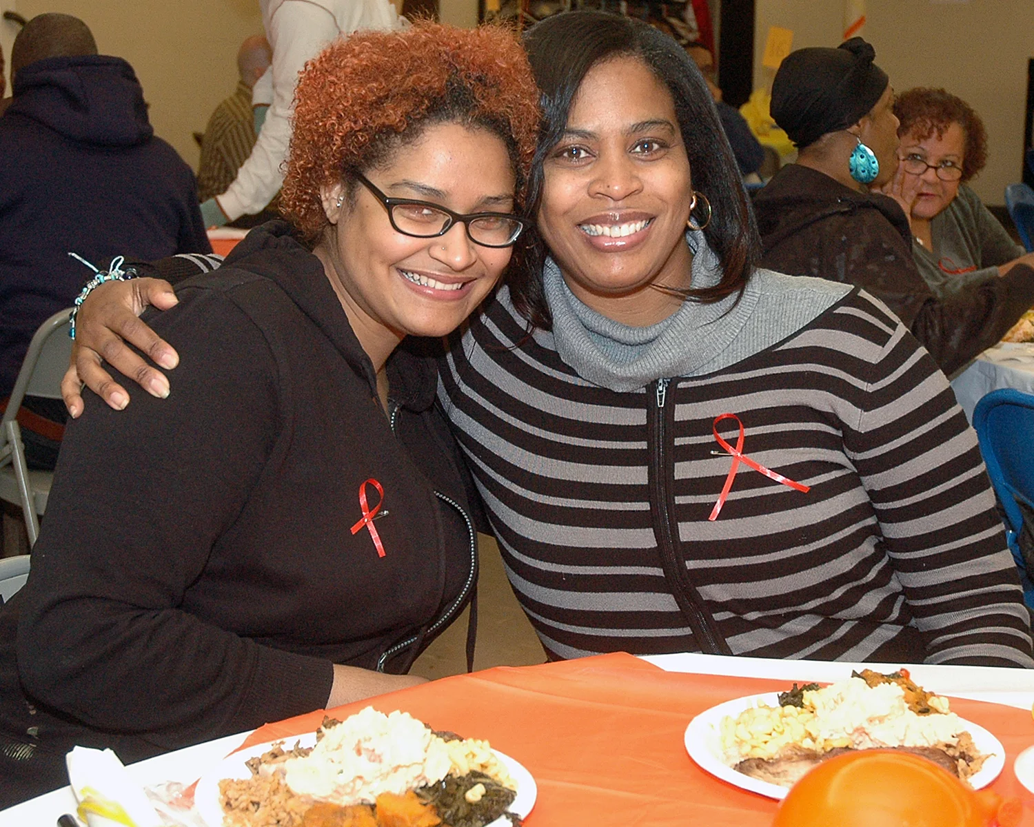 Two attendees enjoying the festivities
