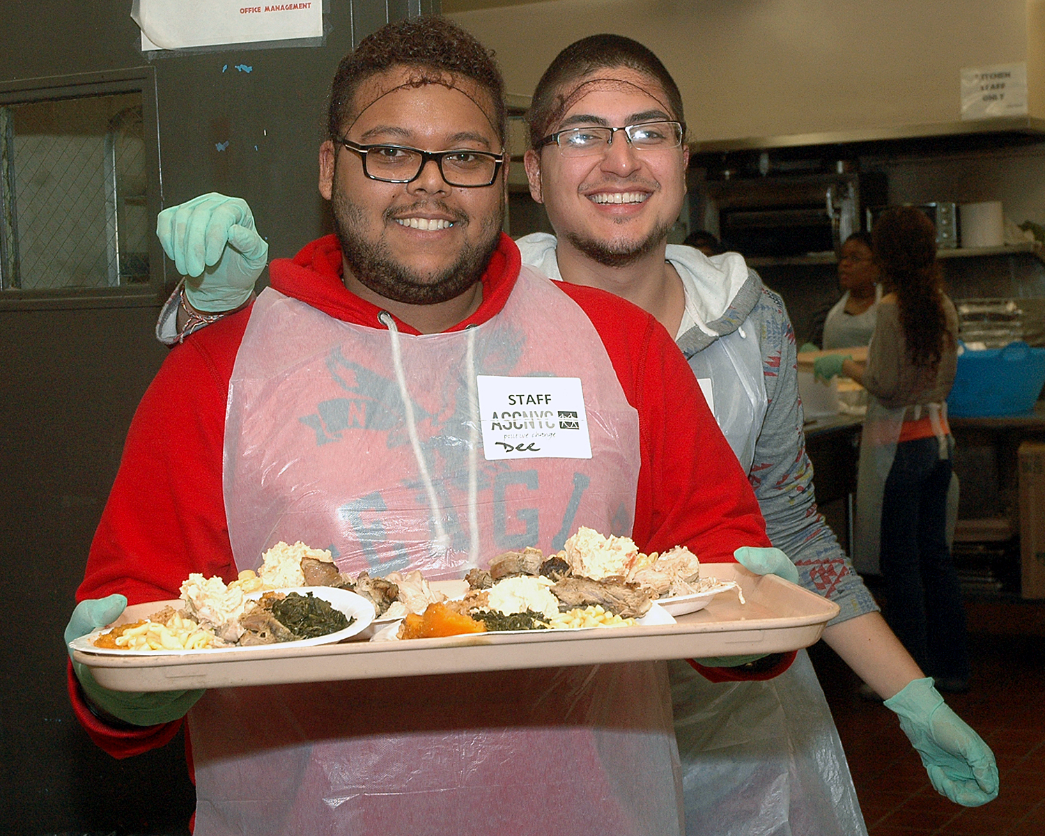 Two ASCNYC Staff Members serving the attendees