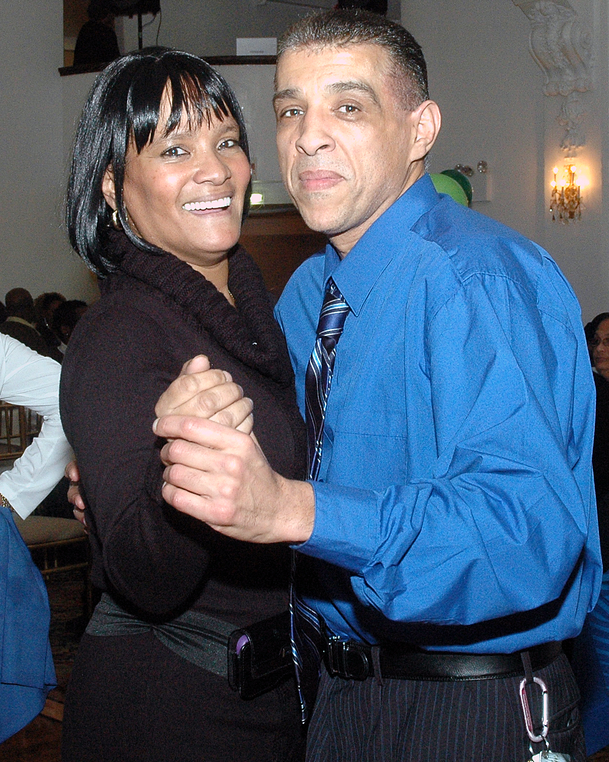 Two attendees strike a pose on the dance floor