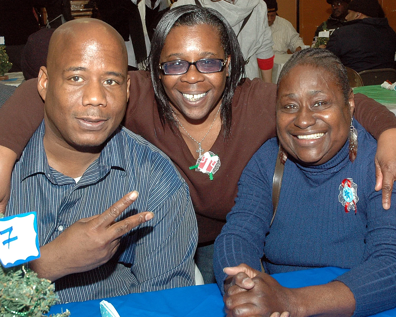 Three attendees enjoying the celebration