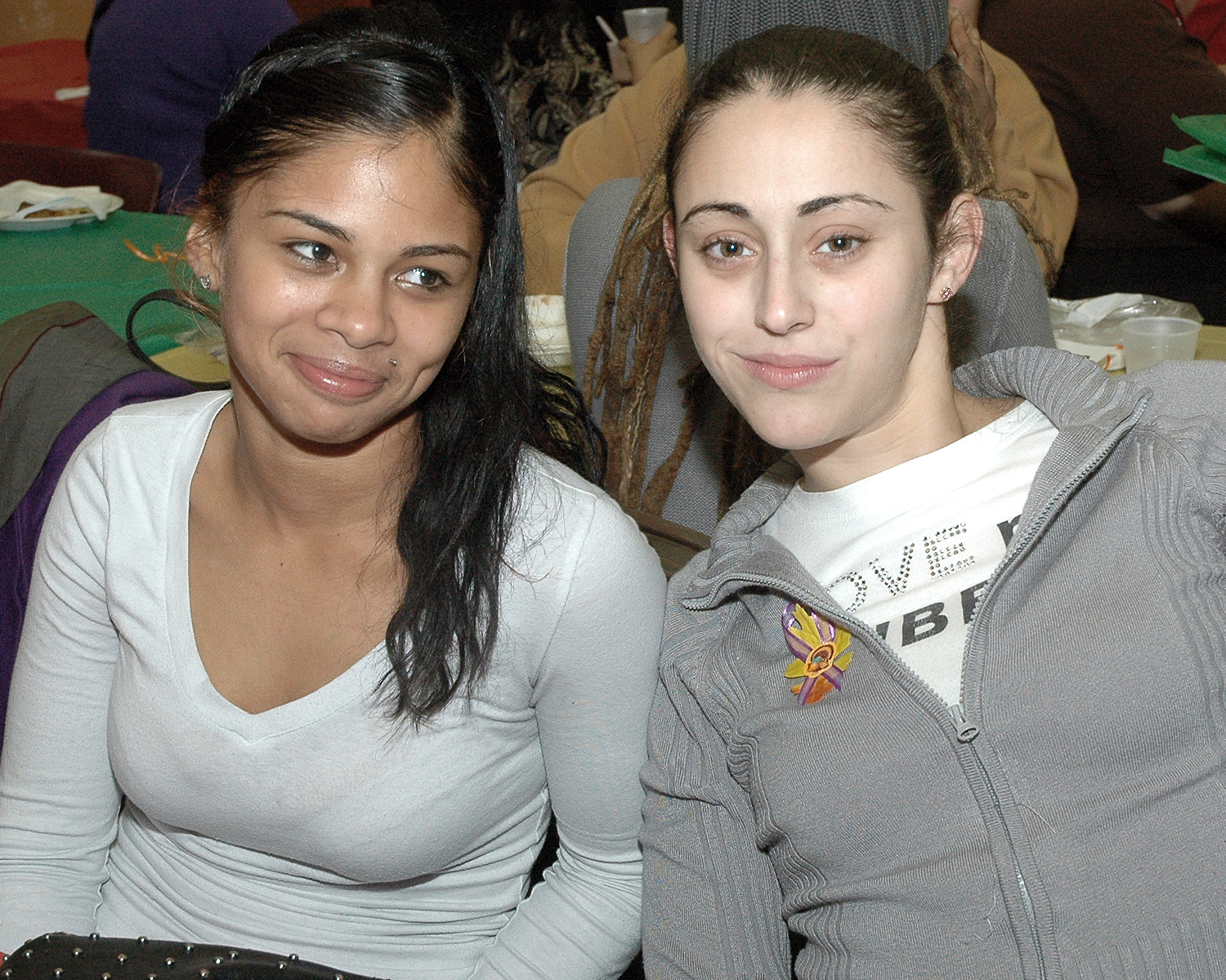 Two attendees enjoying the Thanksgiving celebration