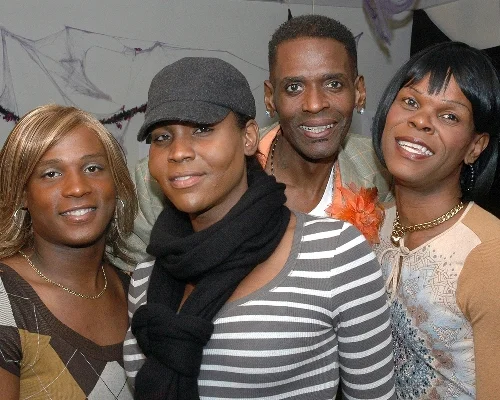 Four attendees enjoying the party