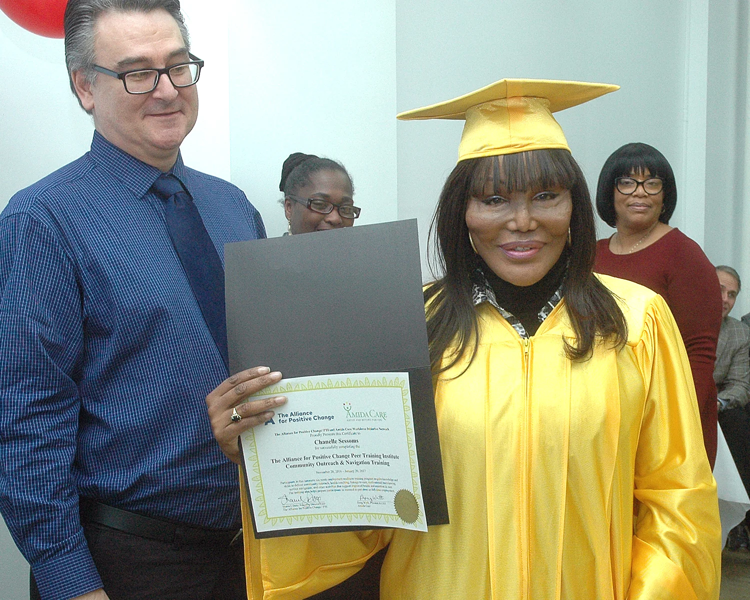 Chanelle S. receiving her certificate