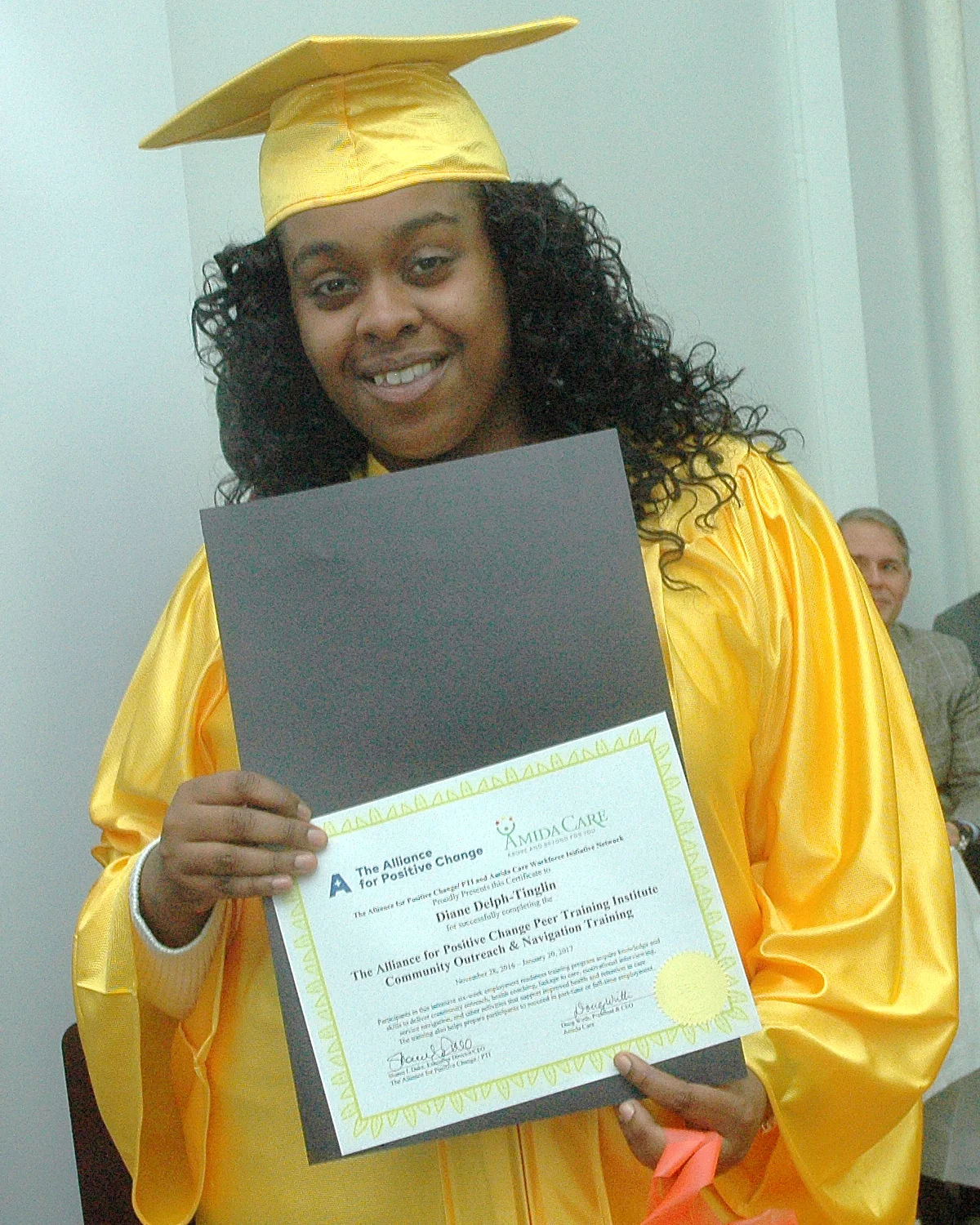 Diane D. receiving her certificate