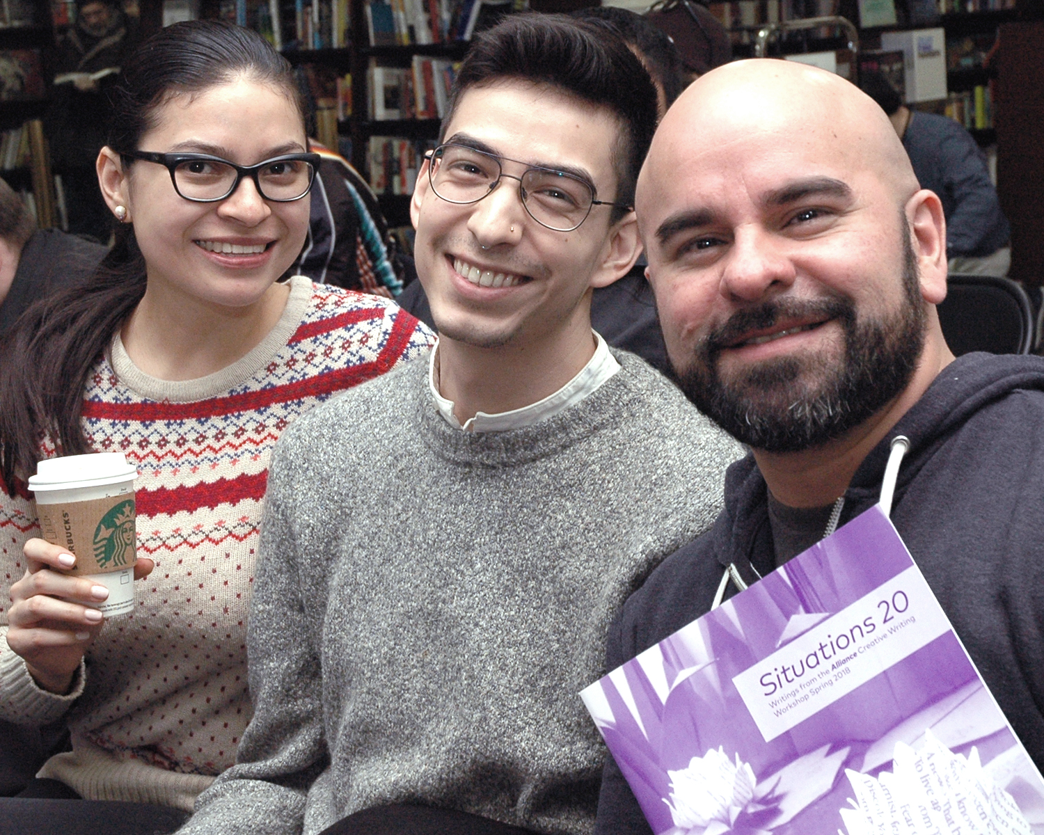 Three Alliance Staff Members enjoying the poetry reading