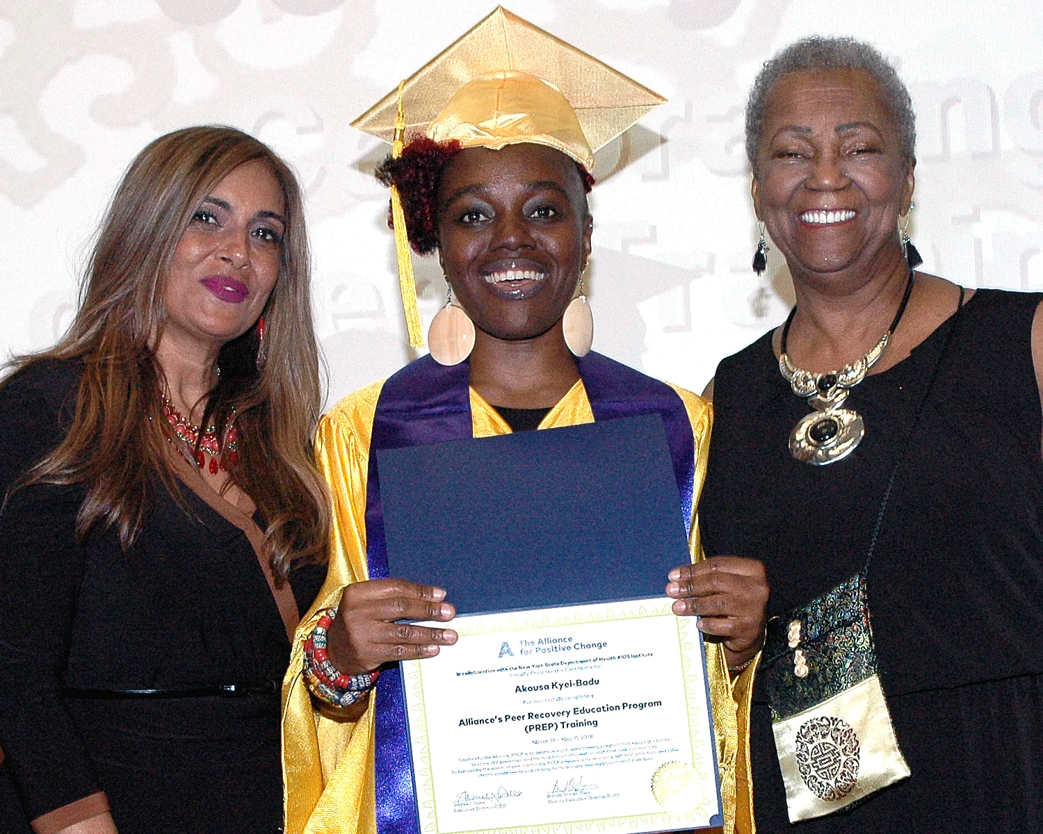 Akousa K. receiving her certificate
