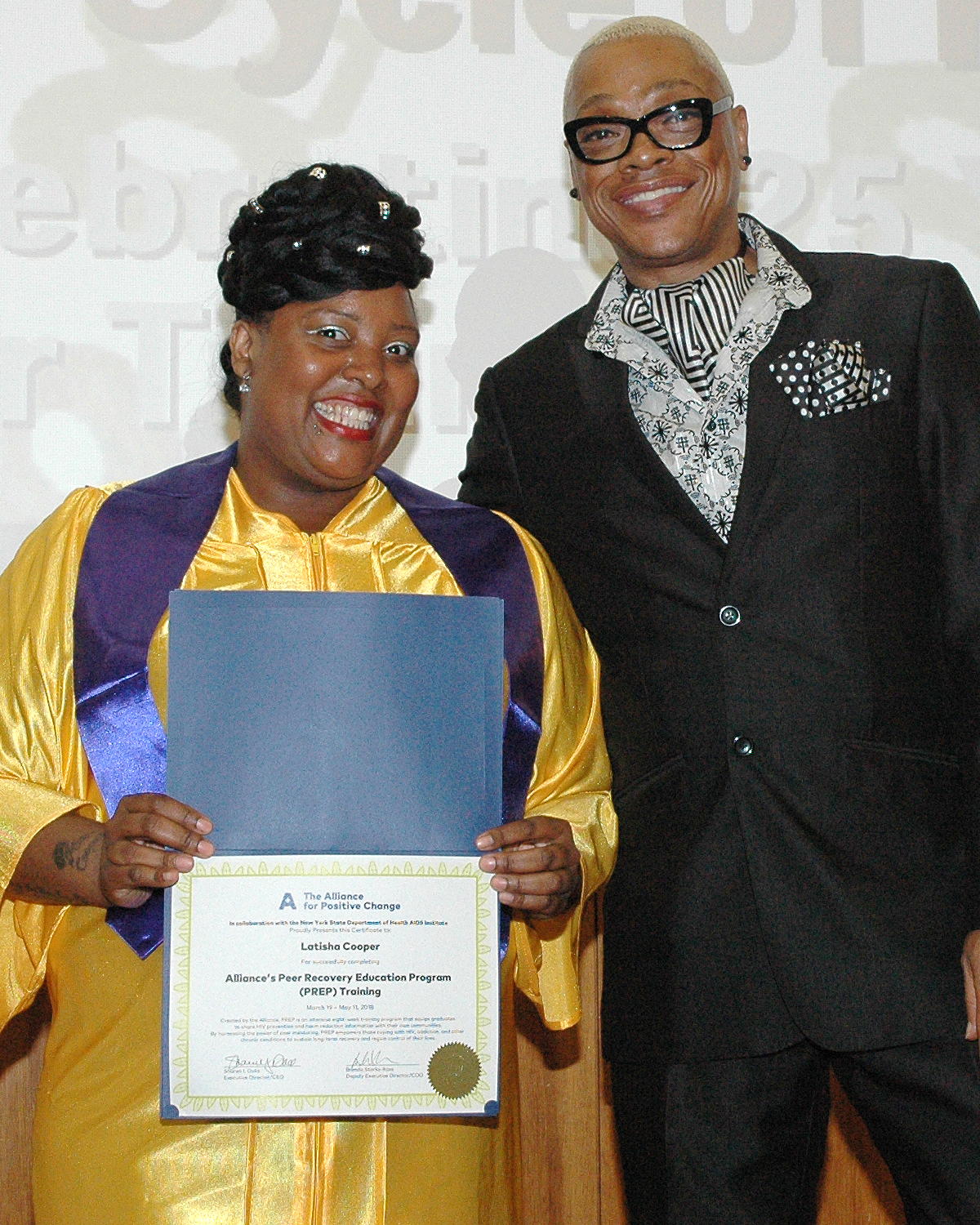 Latisha C. receiving her certificate