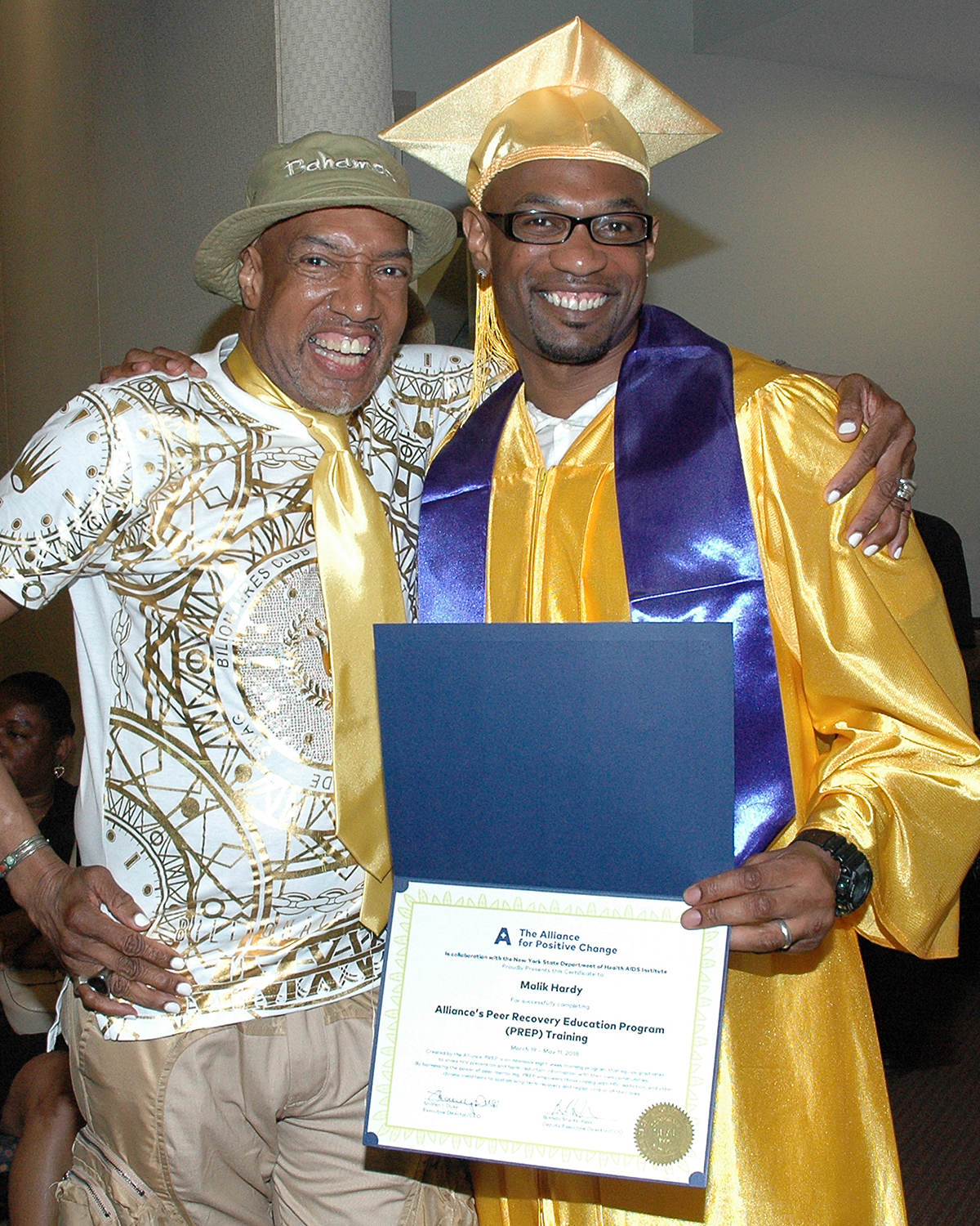 Thomas P. and Malik H. with Malik's certificate