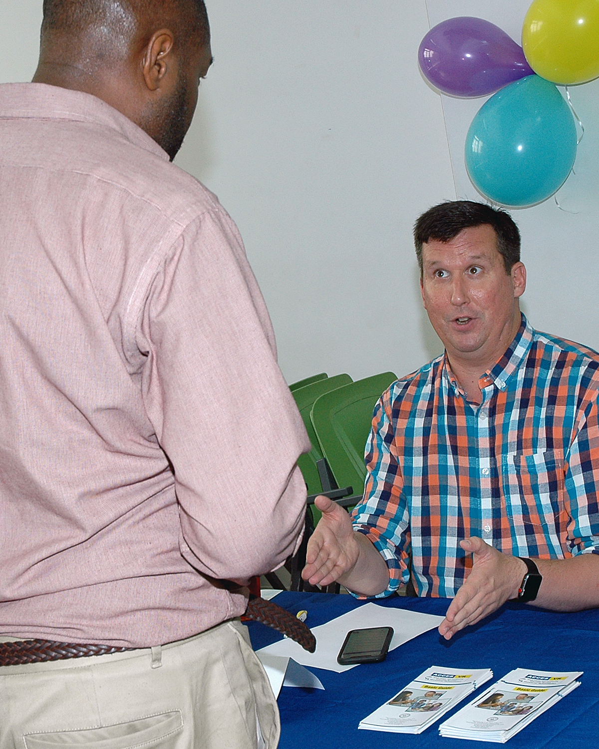 One of the job fair interviewers with an attendee