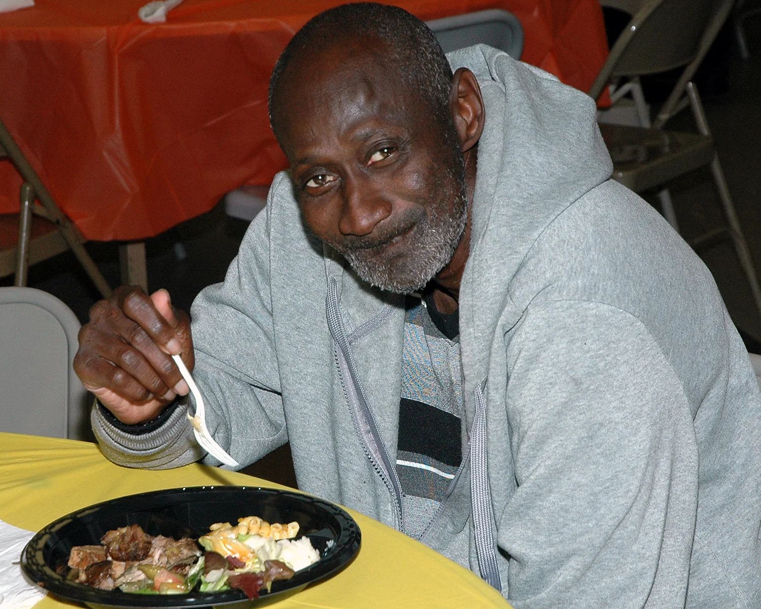 An attendee enjoying his meal