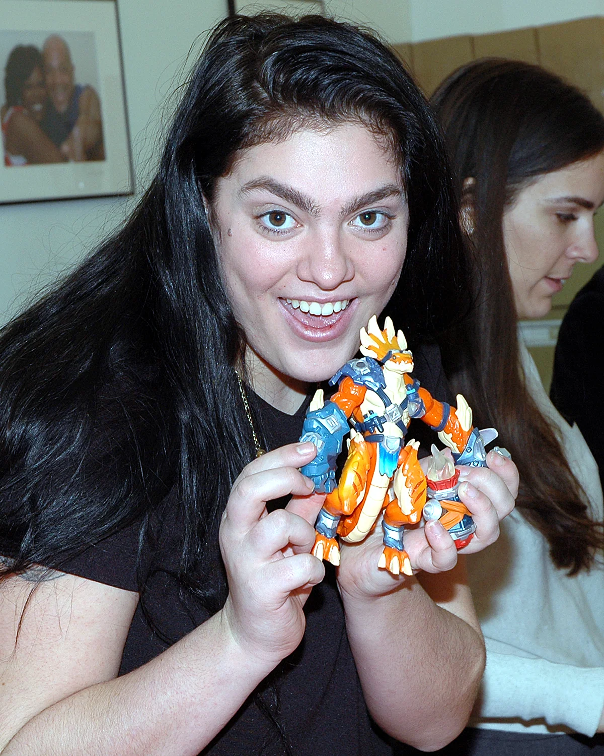 A volunteer showing the results of her gift wrapping