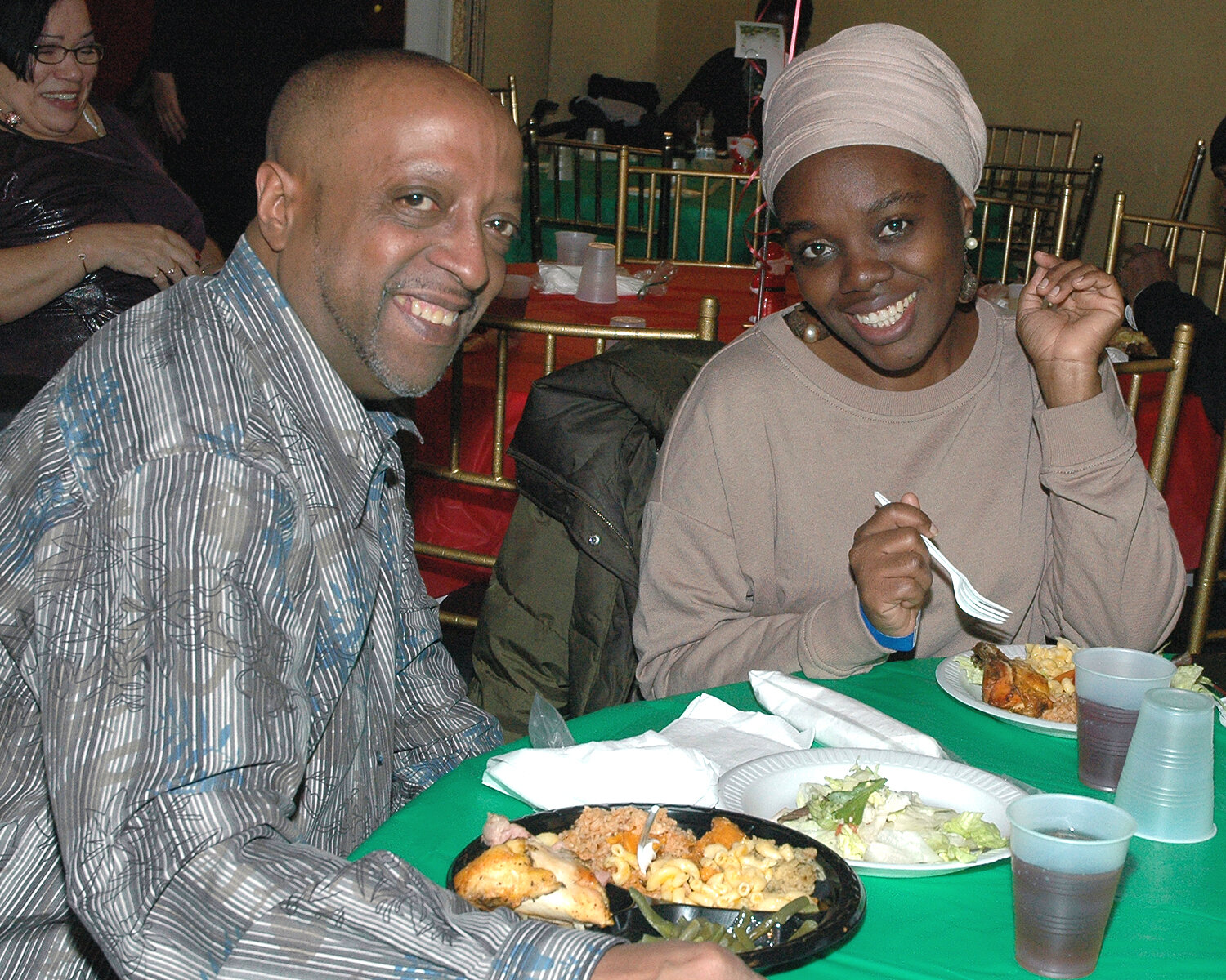 Two attendees enjoying their Holiday Meal