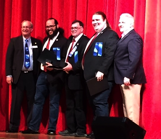 Harmonic Collective members receiving Songbird Awards. (L-R District Vice President David Bay, Tito Reyes, Gene Evans, Sagan Harris, District President Nathan Bell)