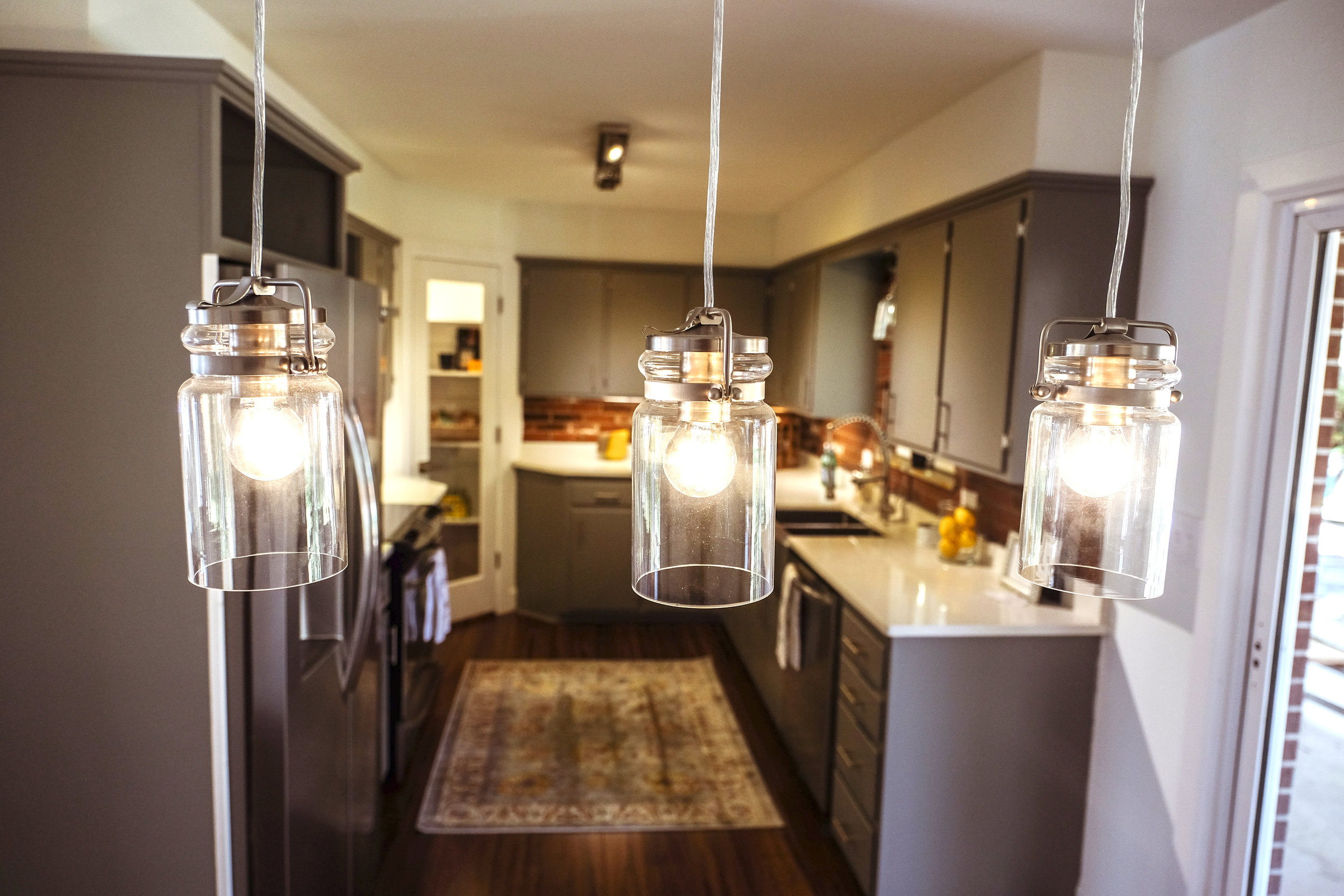 The solid construction and mid-century styling of the cabinets convinced us to restore rather than replace the original cabinets.