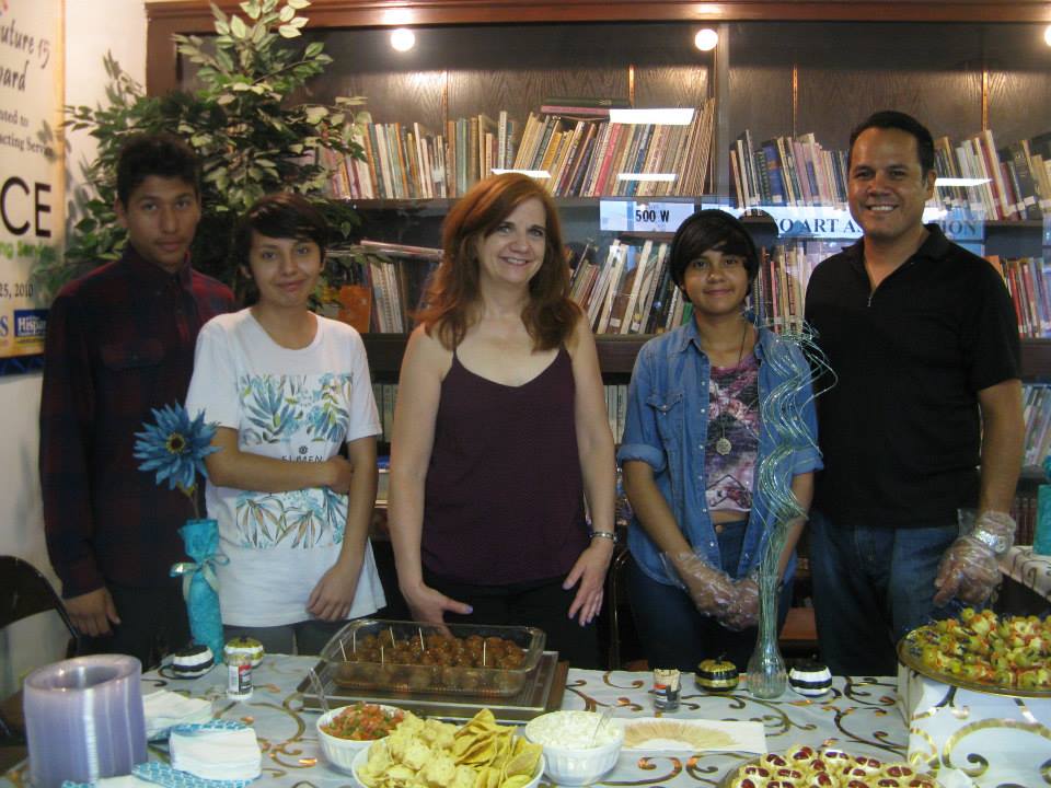 Ginny Fischer and happy hospitality volunteers at Arts International Gala opening. 