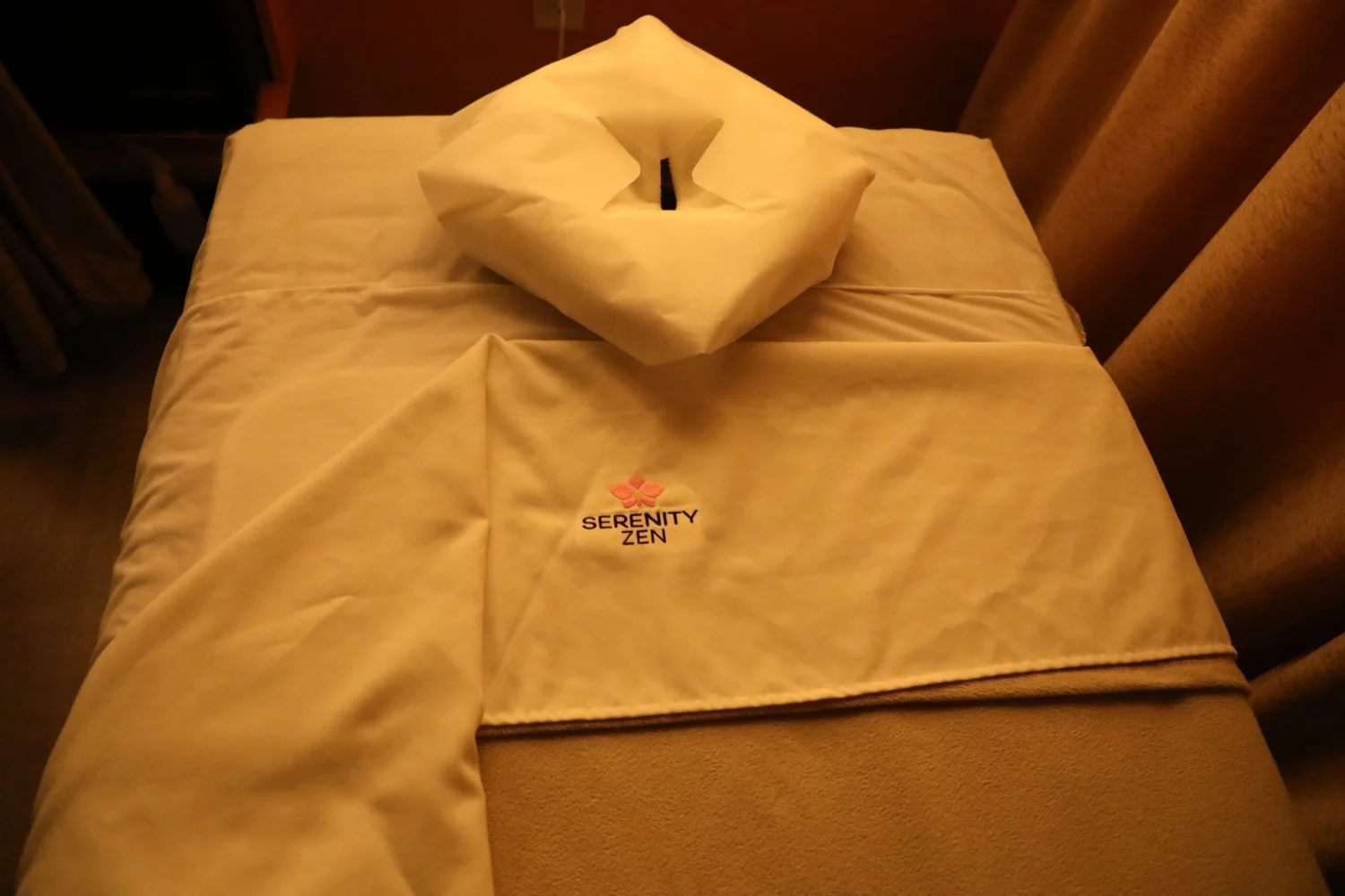 A massage table made up with a Serenity Zen sheet and face cradle