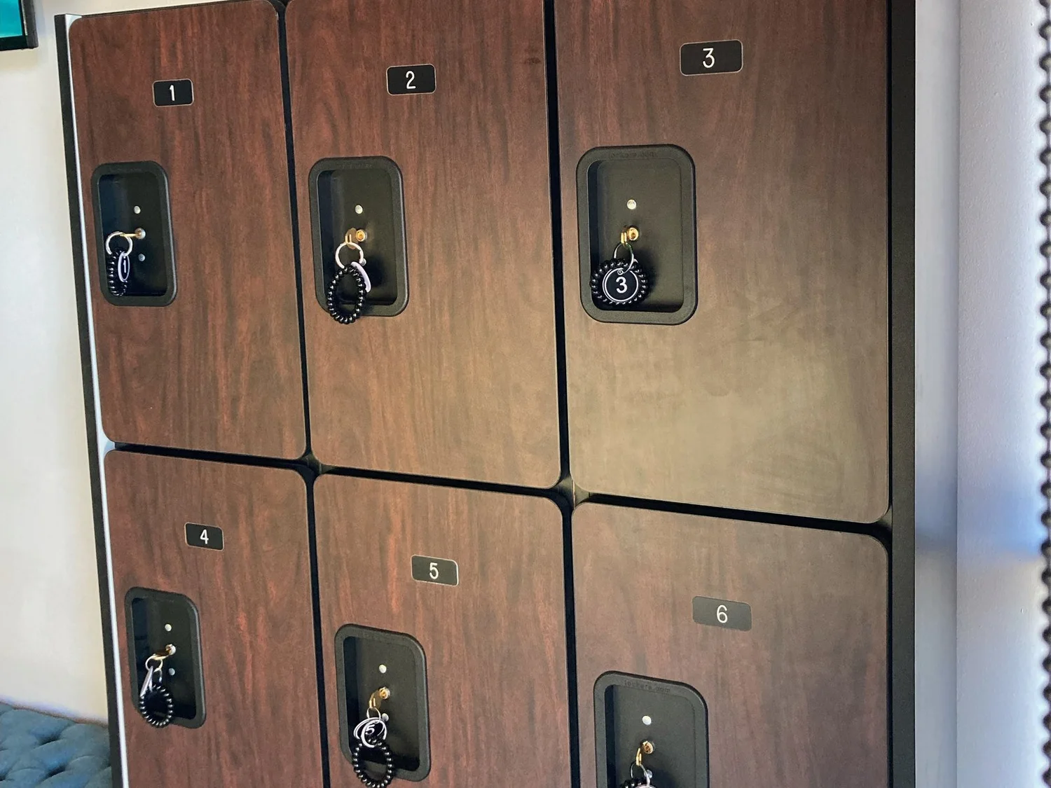 Wooden lockers with key bracelets at Serenity Zen Diamond Bar