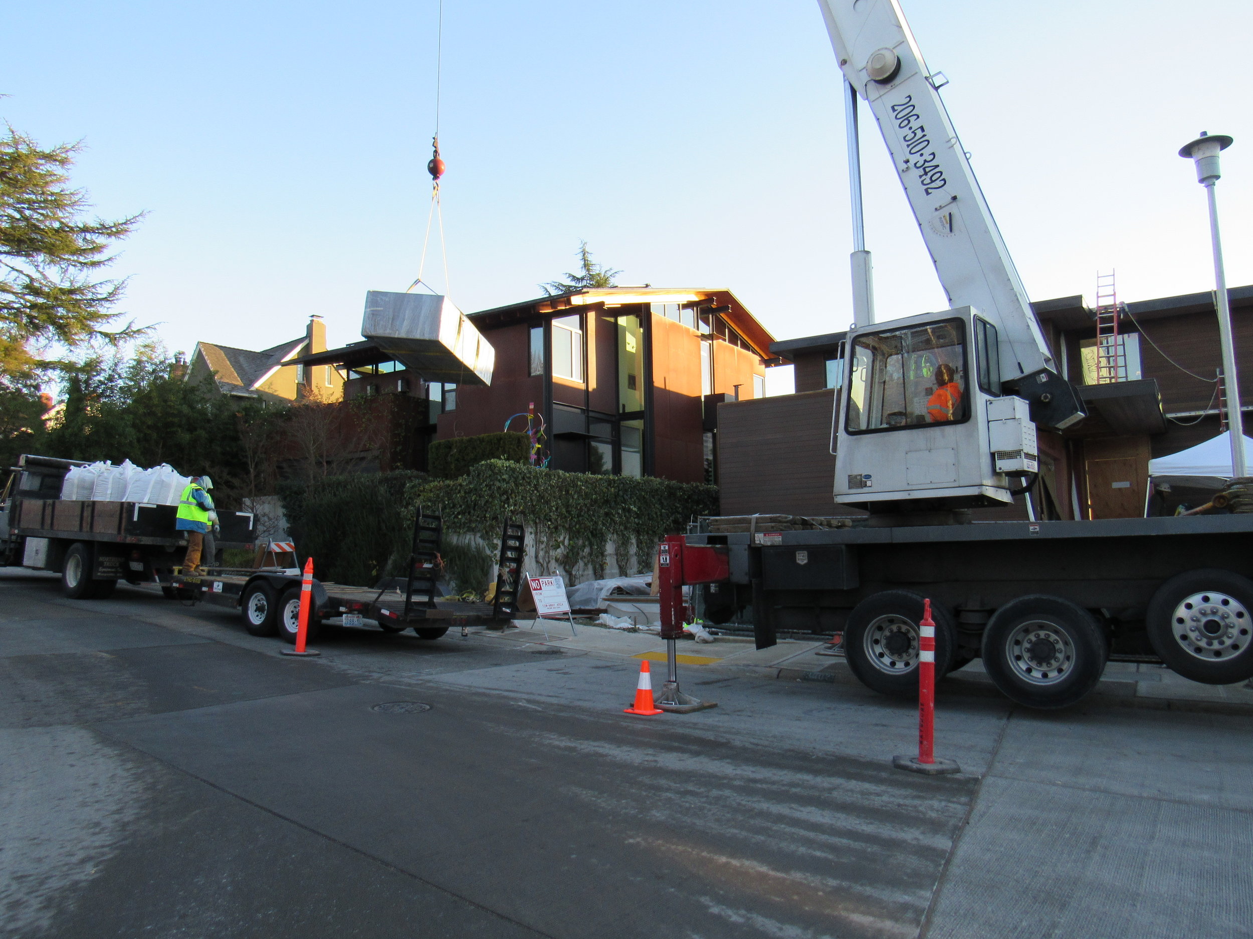 We needed the help of a crane to hoist these massive planters on to the rooftop deck.