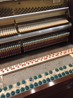 Keybed (under the keys) of a trade-in before we vacuumed it out.