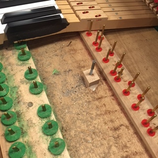 This is what it could look like under the keys of a used piano. We will clean this completely.