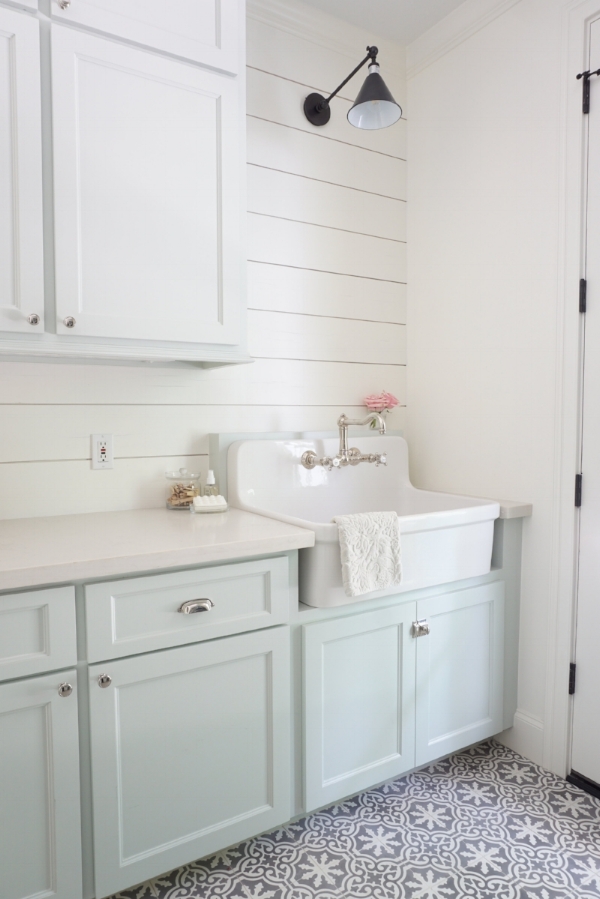 Cambridge Row; a laundry room at the Conroe Farmhouse with White Quartz