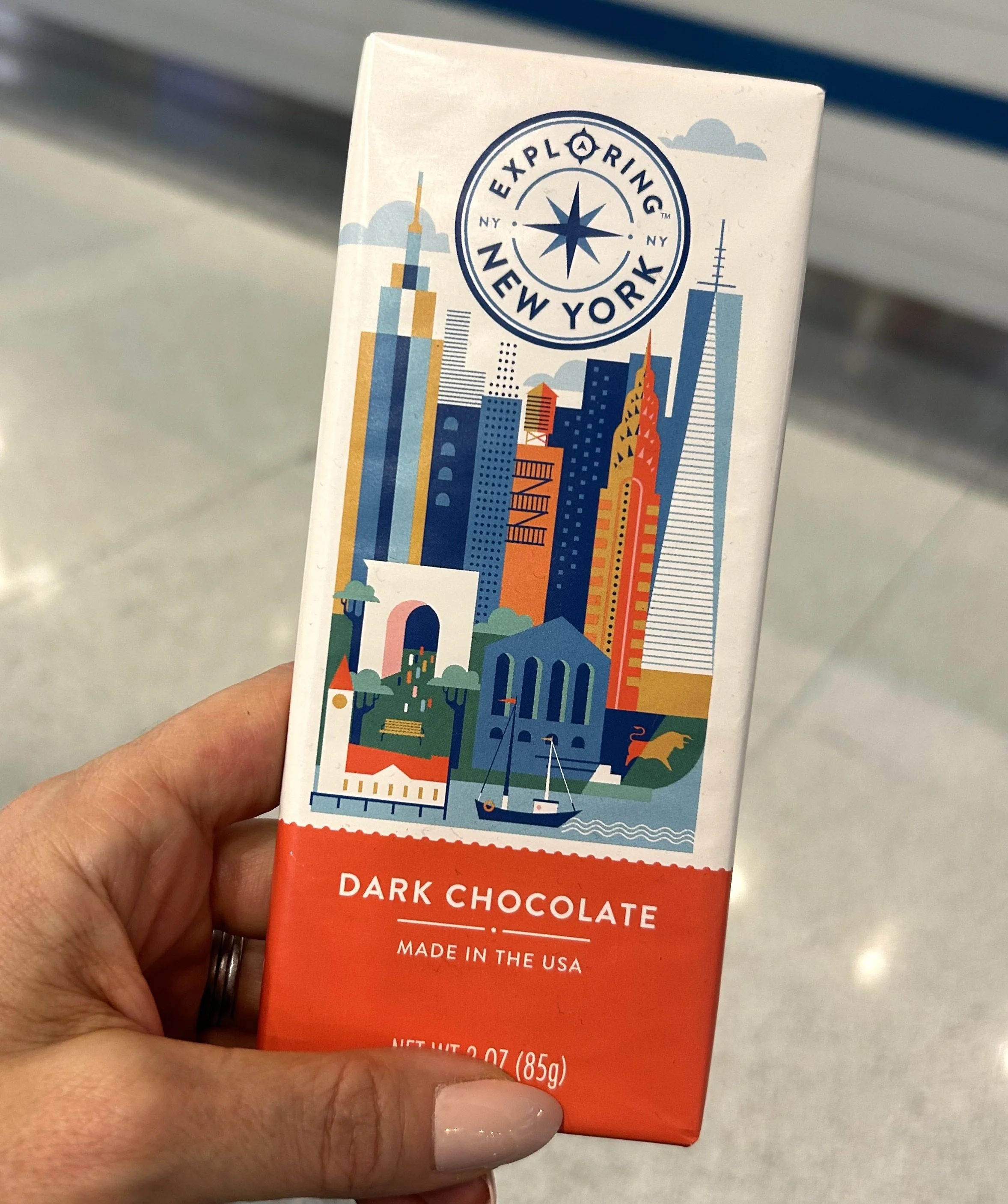 New York Cityscape illustration on chocolate bar packaging for the Dufry Duty Free shop at Newark Airport