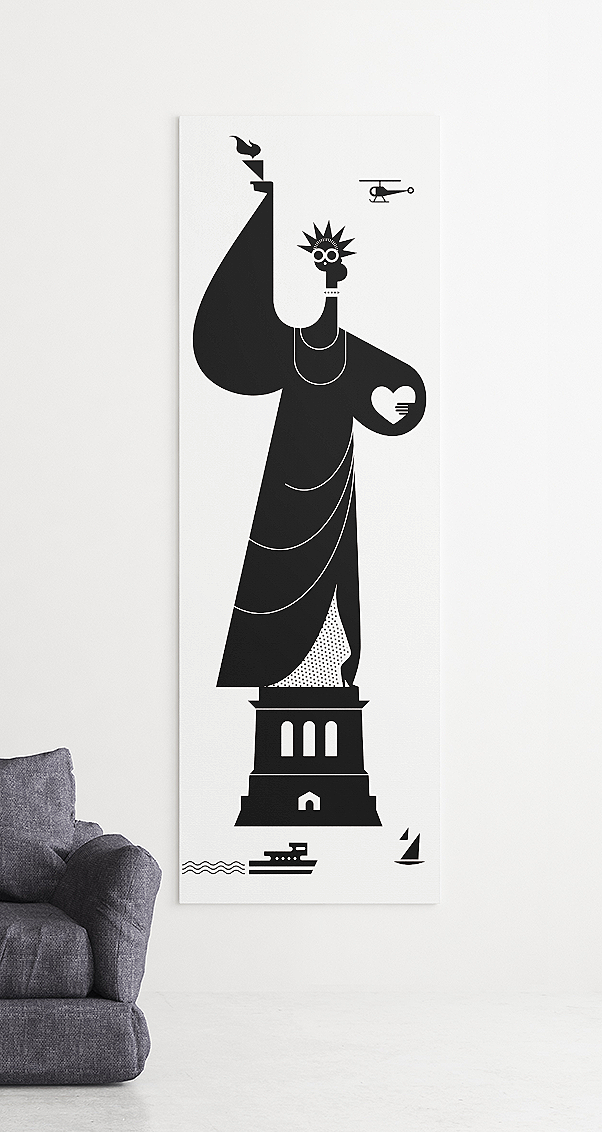 Vertical black and white Statue of Liberty wall art in a modern living room interior