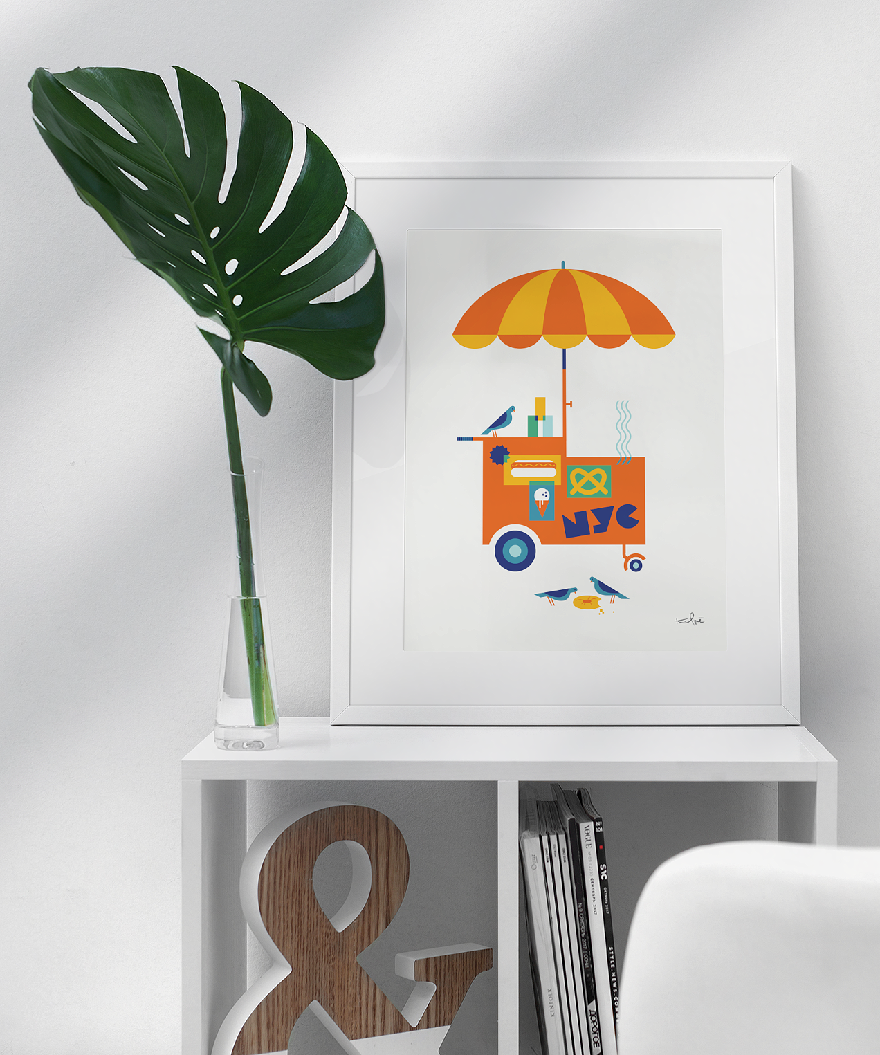 NYC Street Cart illustration print by Kirsten Ulve displayed framed on shelf in modern interior.