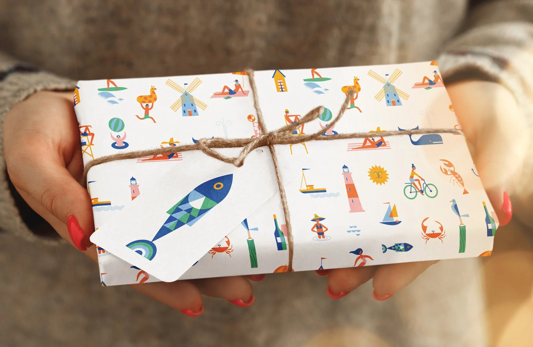 Coastal surface pattern gift wrap featuring illustrated seaside motifs and geometric marine icons.