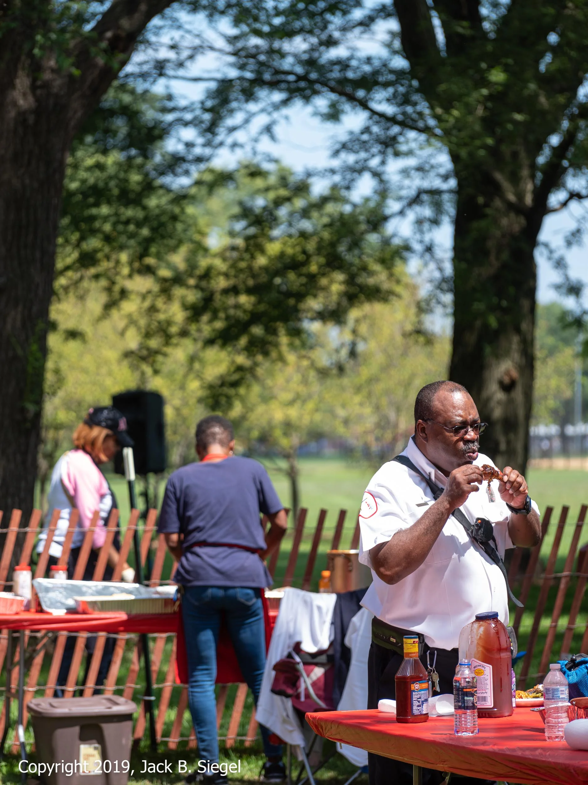 DSCF9203_Copyright 2018 jpeg_Enjoying a Chicken Leg After the Parade.jpg