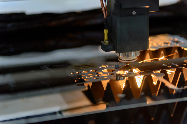 Laser cutting sheet metal for custom metal fabrication.