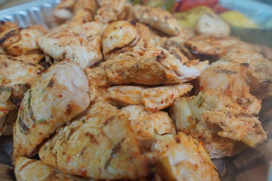 Close-up of grilled marinated halal chicken kabob pieces from ANI Catering's chicken platter