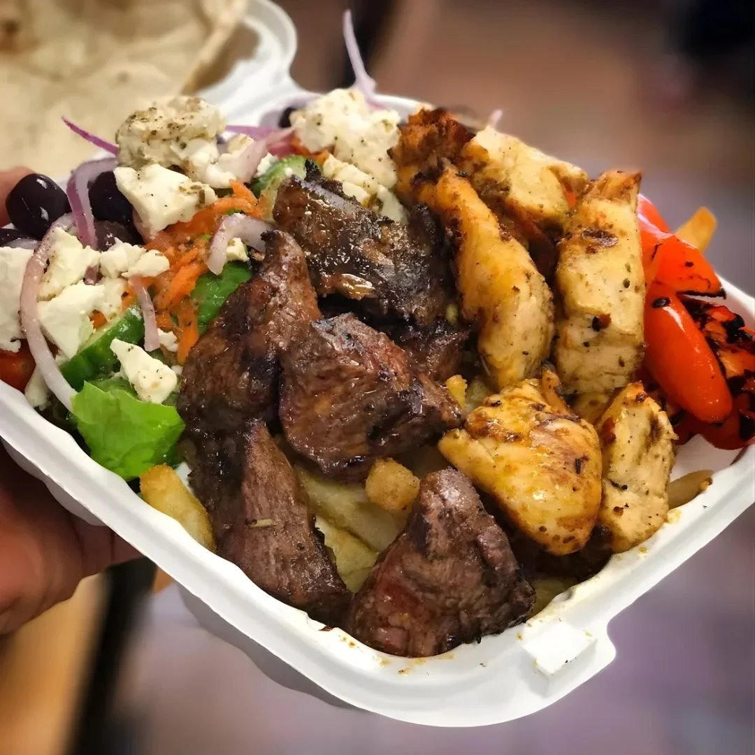 Fresh beef and chicken kabob dinner plate with Greek salad and fries ready for quick pickup at ANI Catering & Cafe in Belmont MA